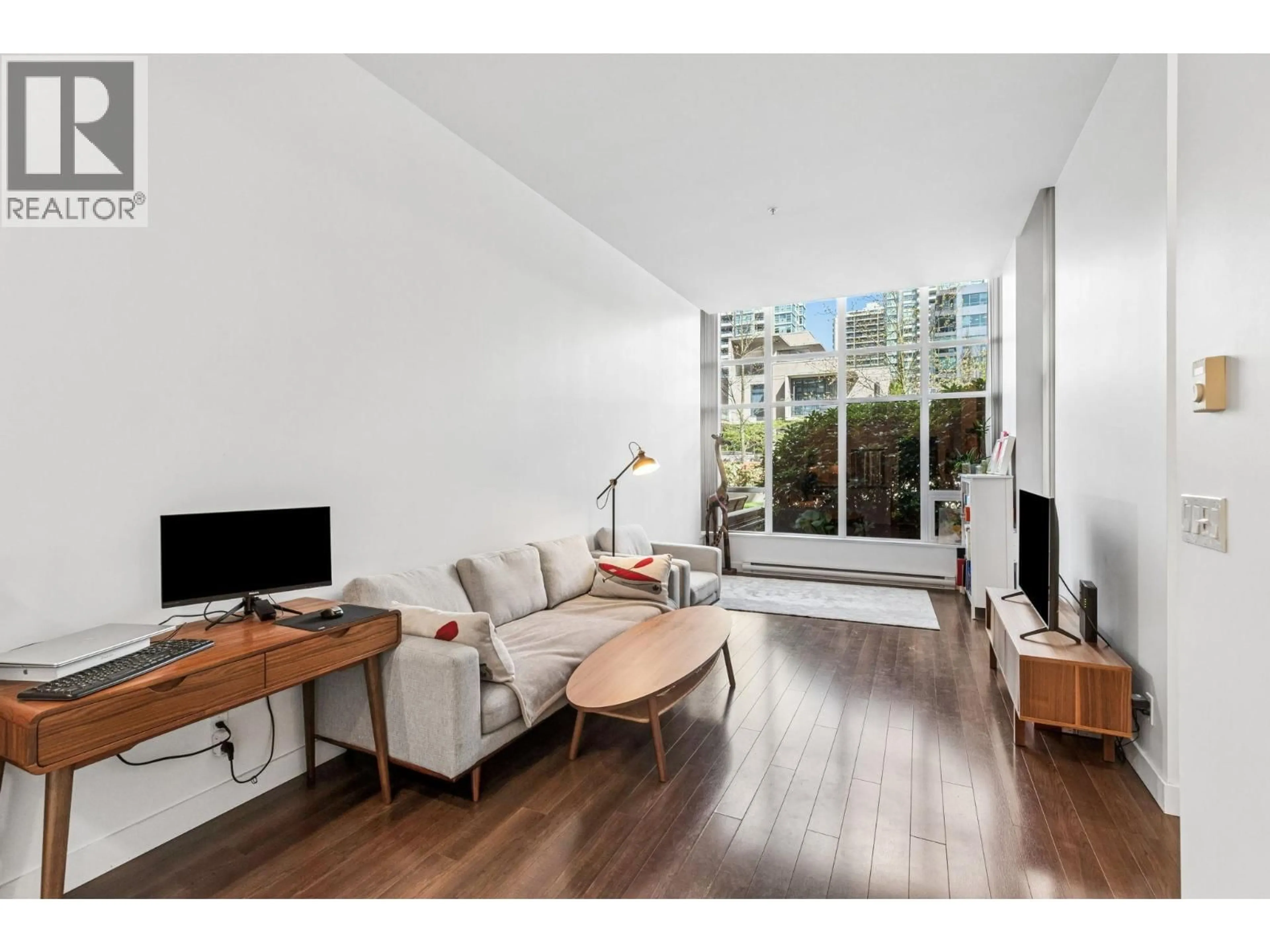 Living room with furniture, wood/laminate floor for 101 - 2077 ROSSER AVENUE, Burnaby British Columbia V5C0E1