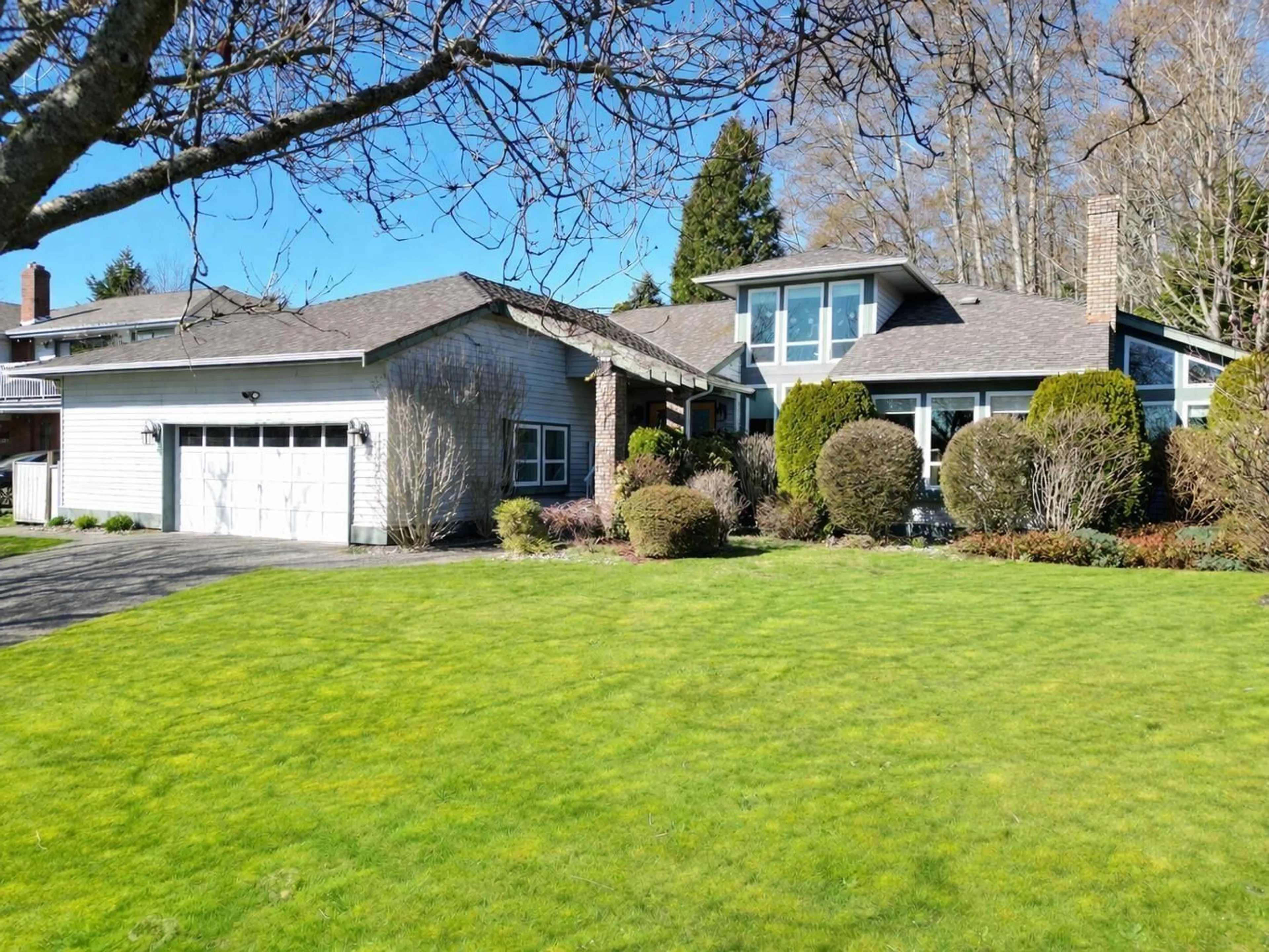 Home with vinyl exterior material, street for 13383 14A AVENUE, Surrey British Columbia V4A7P9