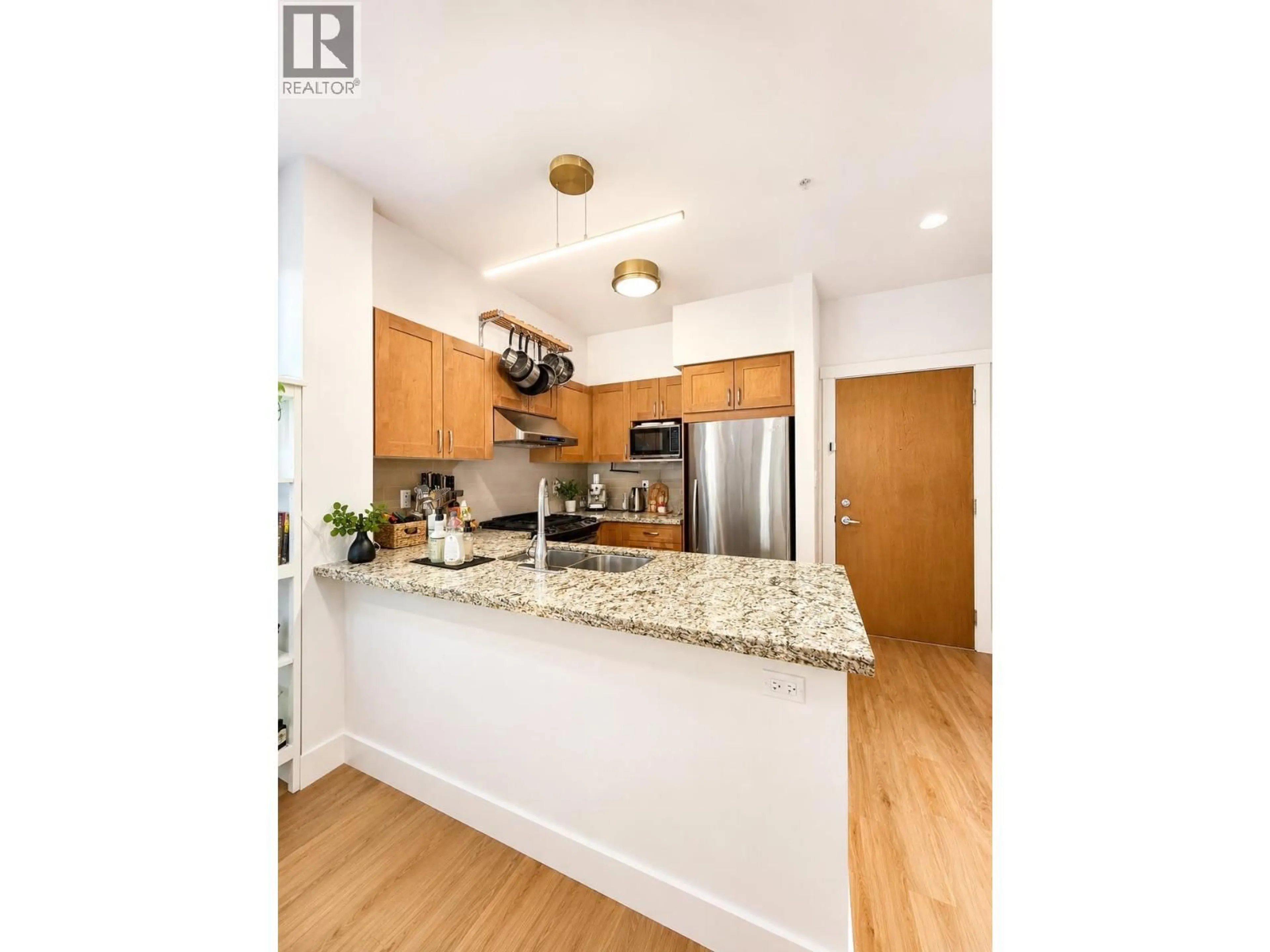 Open concept kitchen, unknown for 318 - 1111 27TH STREET, North Vancouver British Columbia V7J1S3