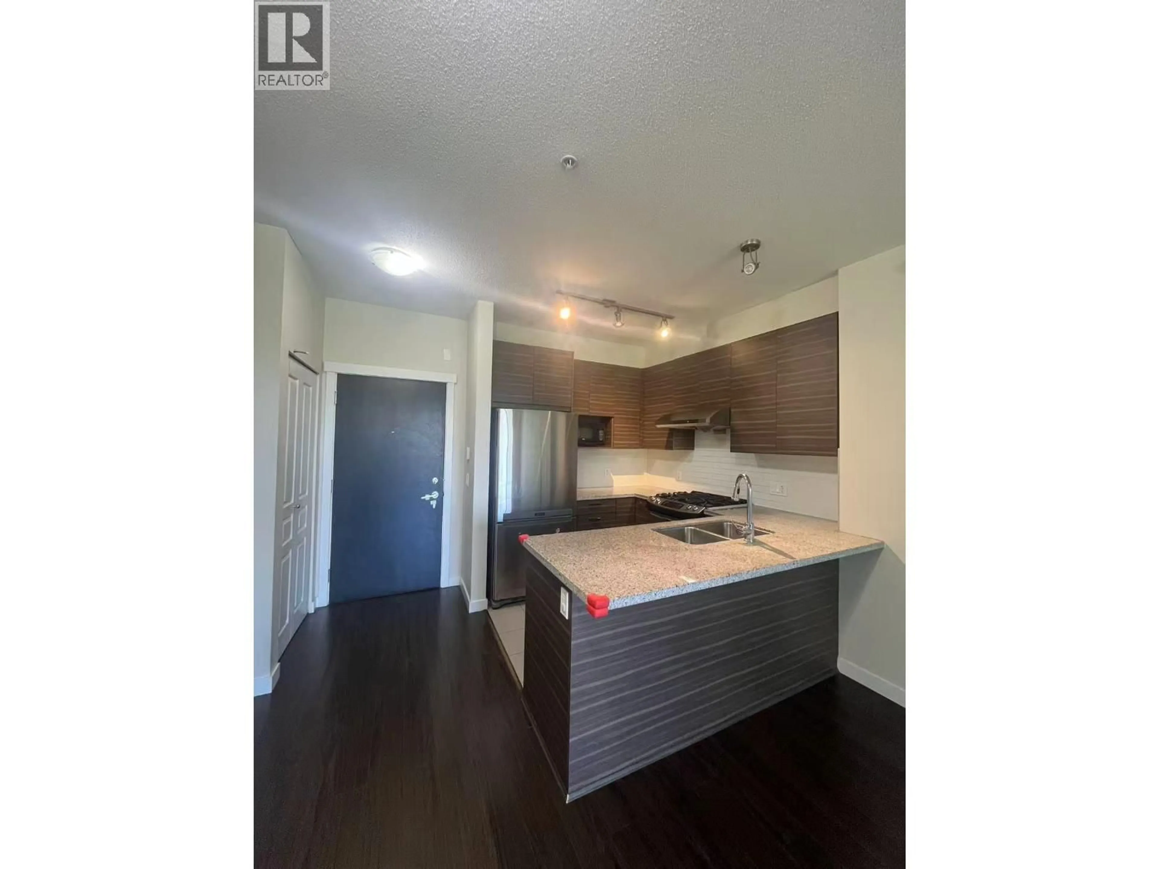 Open concept kitchen, wood/laminate floor for 351 - 9388 MCKIM WAY, Richmond British Columbia V6X0J7