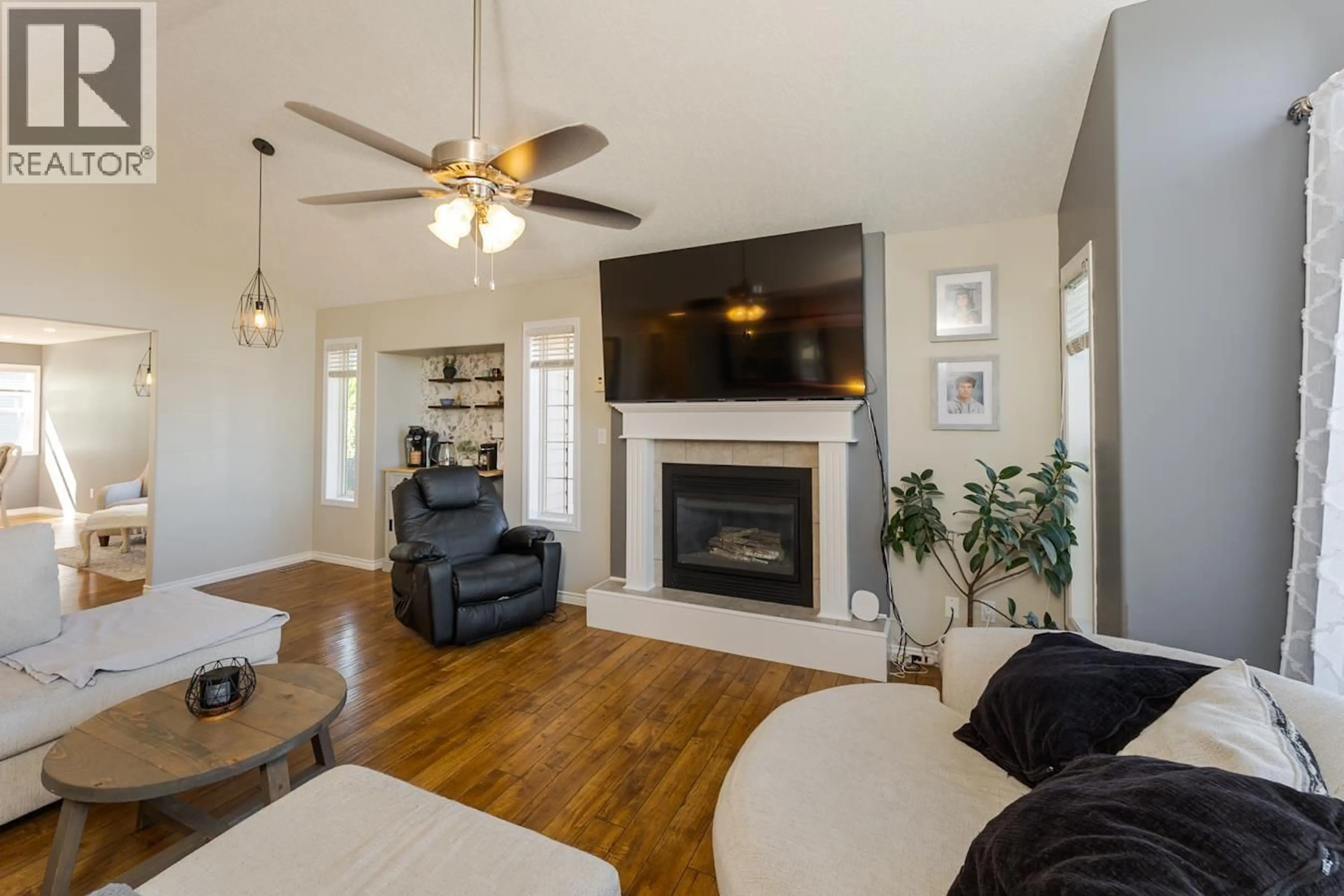 Living room with furniture, wood/laminate floor for 6963 WESTGATE PLACE, Prince George British Columbia V2N5R3
