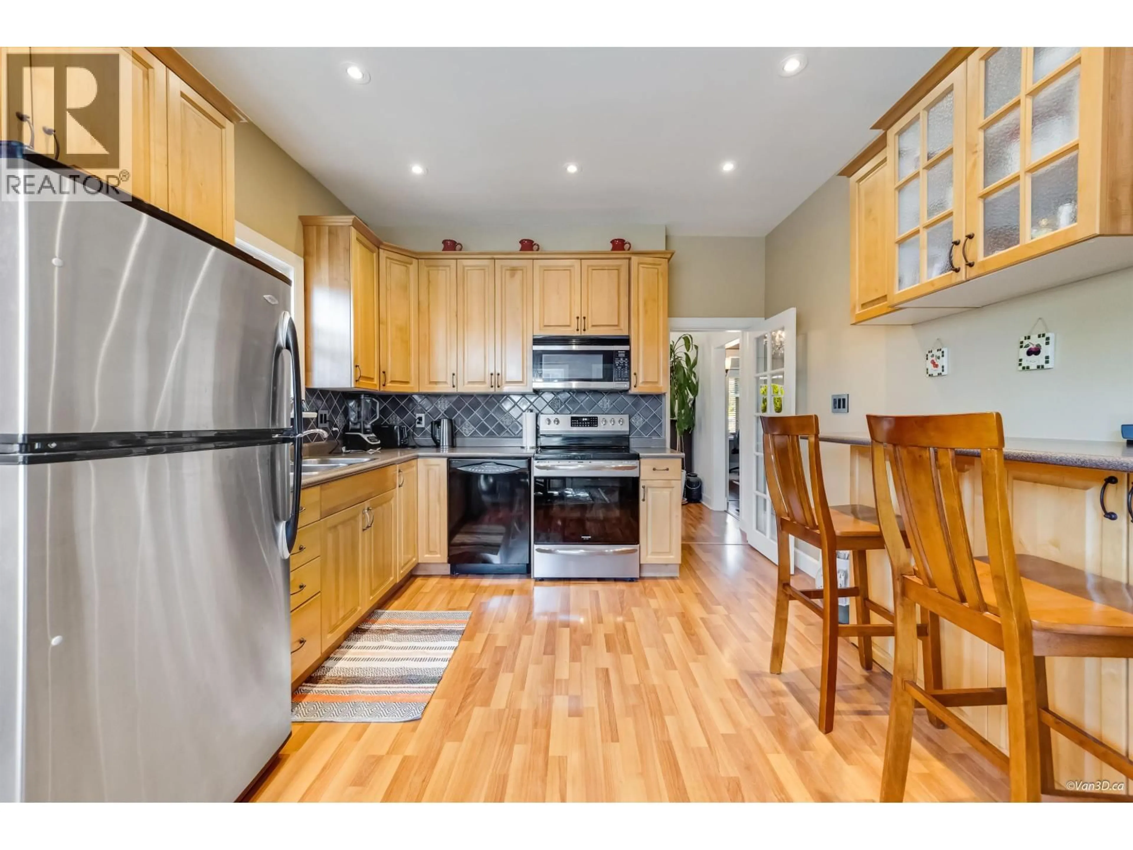 Open concept kitchen, wood/laminate floor for 836 68TH AVENUE, Vancouver British Columbia V6P2V2
