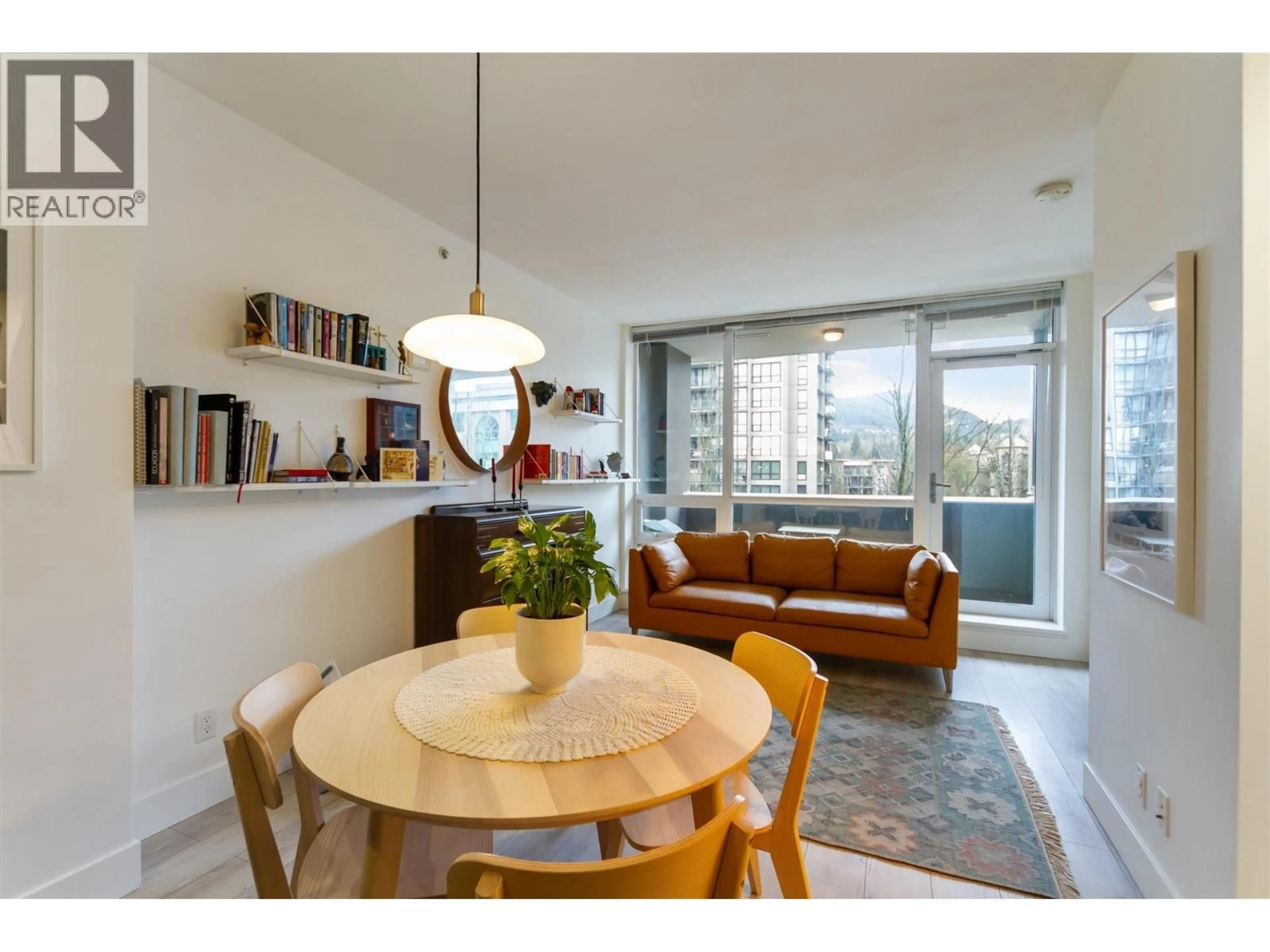 Living room with furniture, wood/laminate floor for 504 - 2968 GLEN DRIVE, Coquitlam British Columbia V3B0C4