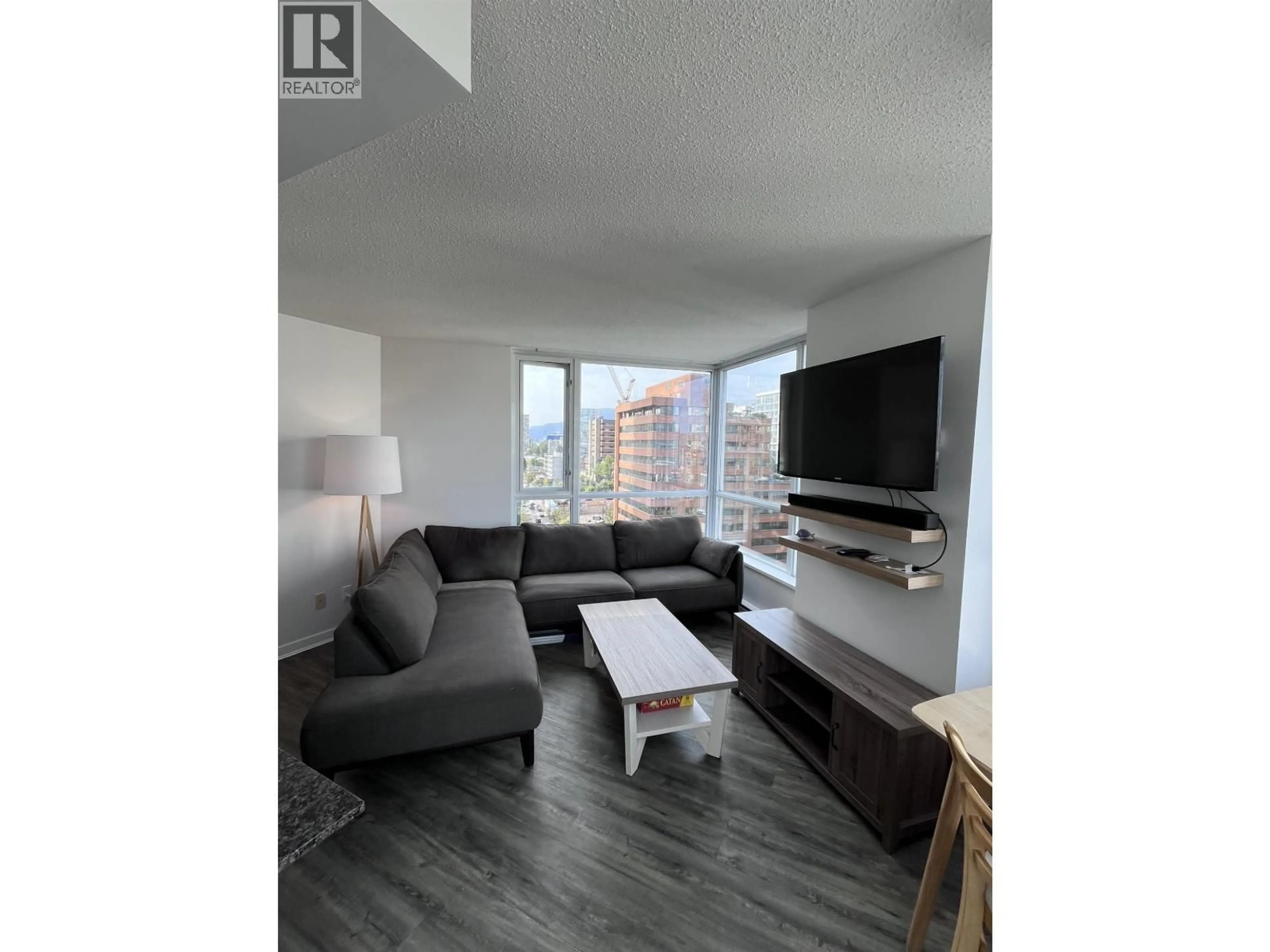 Living room with furniture, wood/laminate floor for 1602 - 1212 HOWE STREET, Vancouver British Columbia V6Z2M9