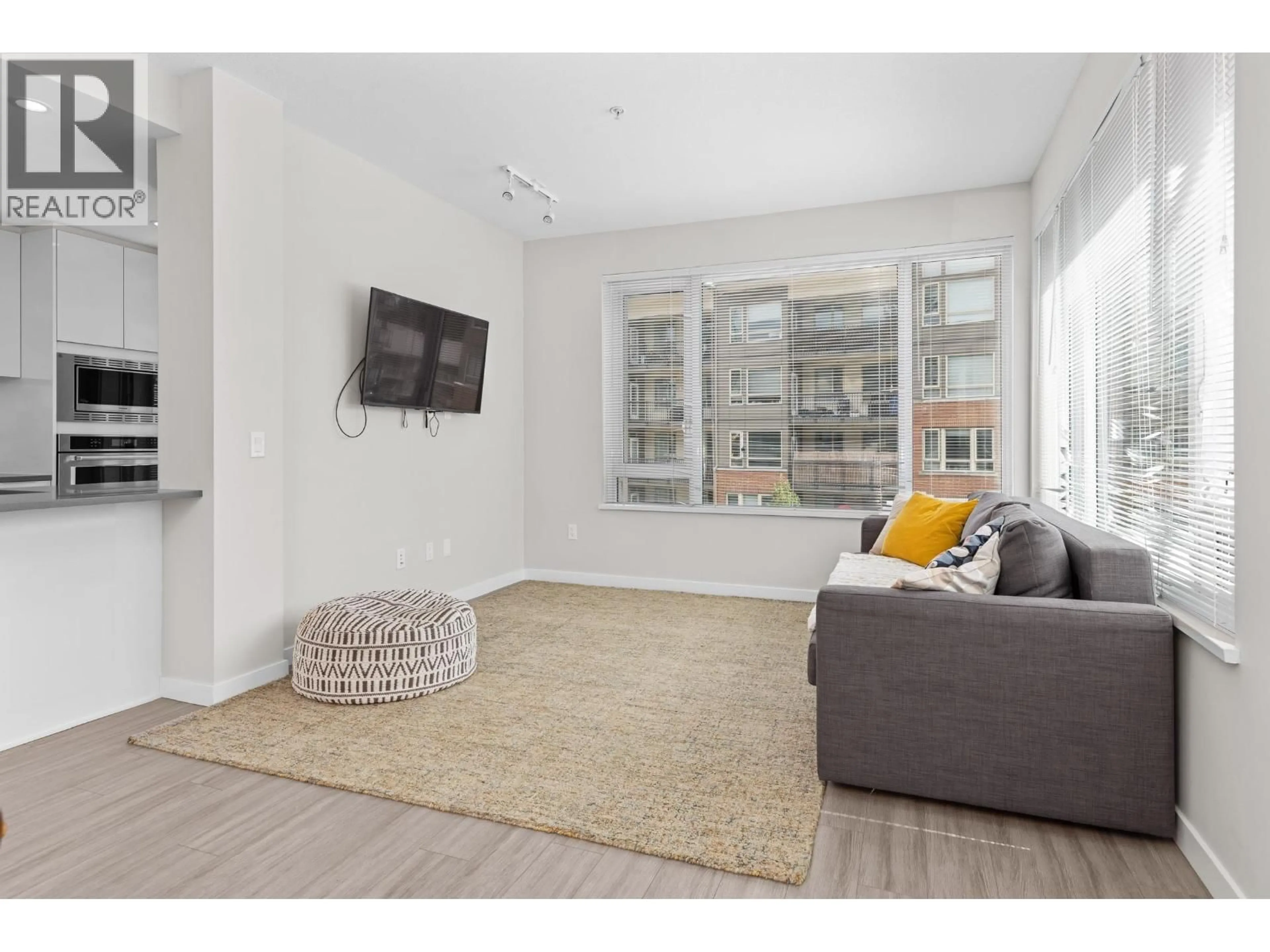Living room with furniture, unknown for 212 - 2663 LIBRARY LANE, North Vancouver British Columbia V7J0B9