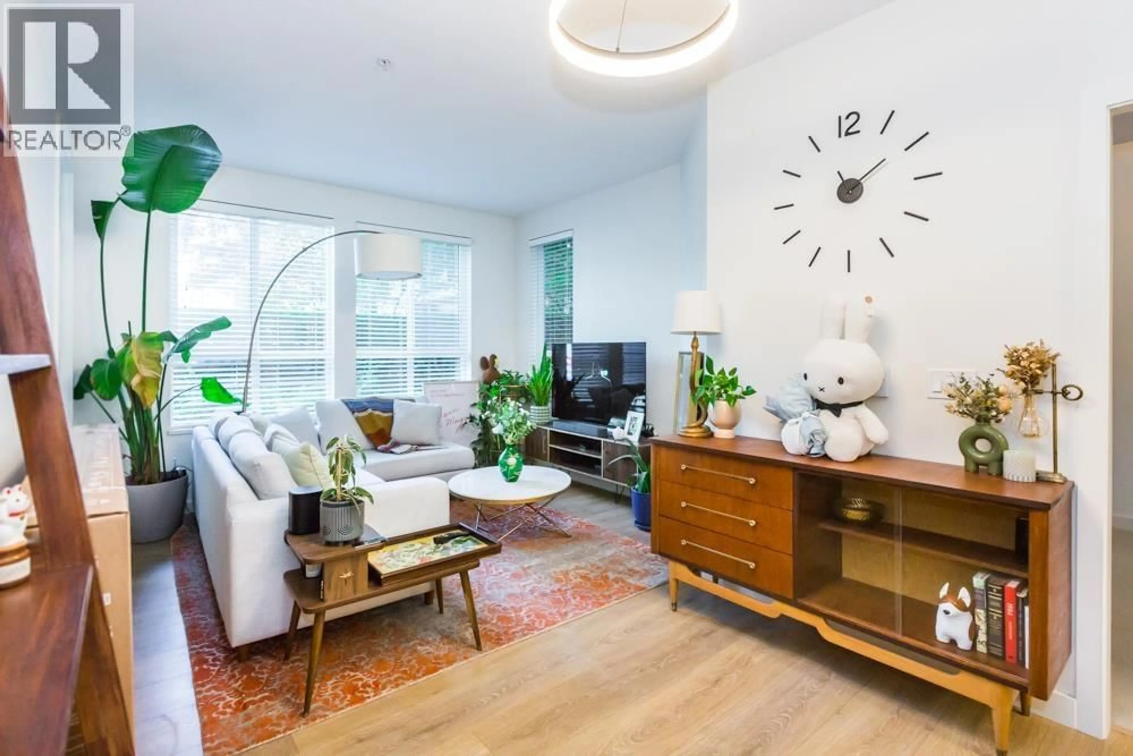 Living room with furniture, wood/laminate floor for 102 - 611 REGAN AVENUE, Coquitlam British Columbia V3J0E5