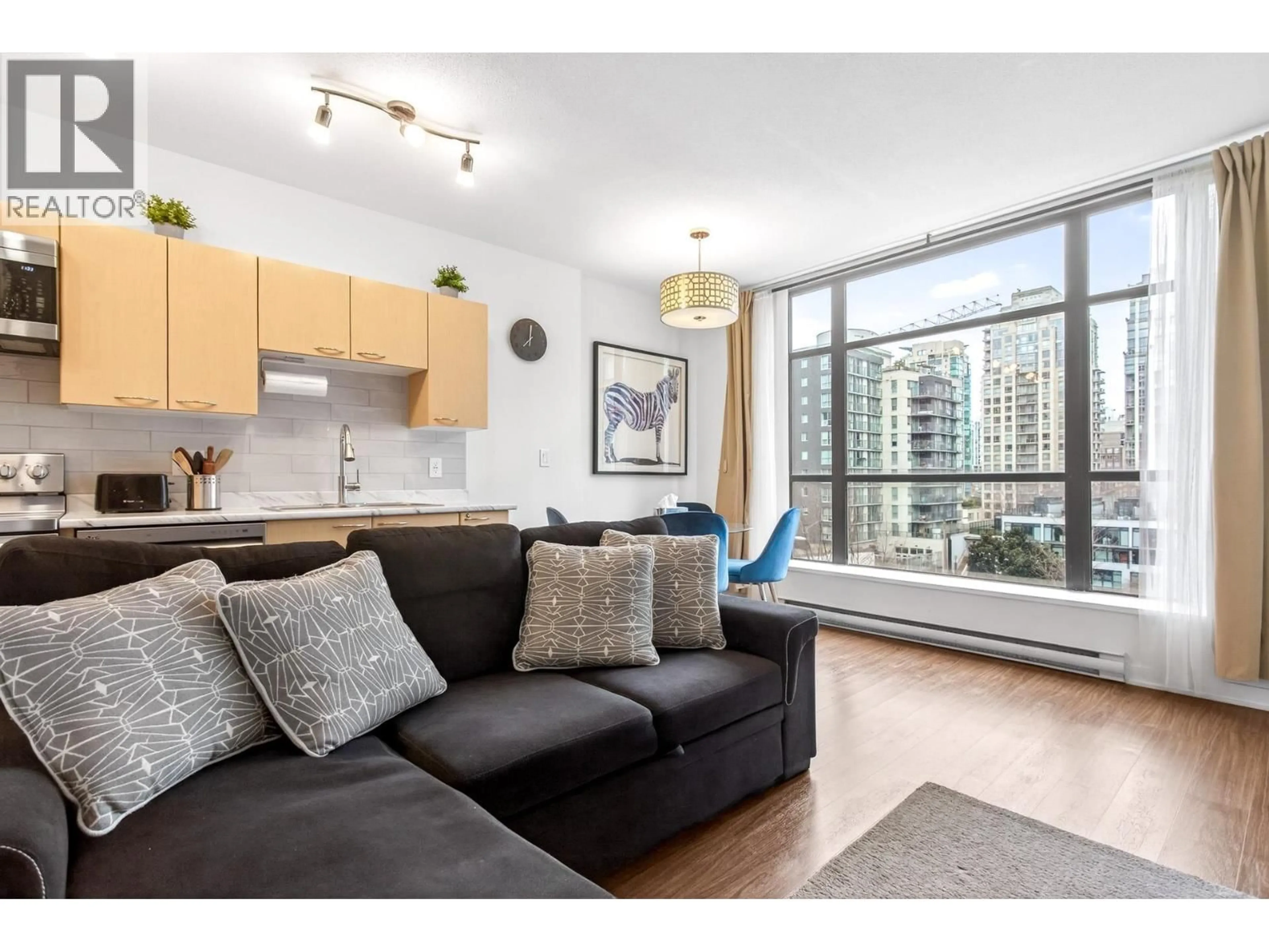 Living room with furniture, wood/laminate floor for 507 - 1249 GRANVILLE STREET, Vancouver British Columbia V6Z1M5