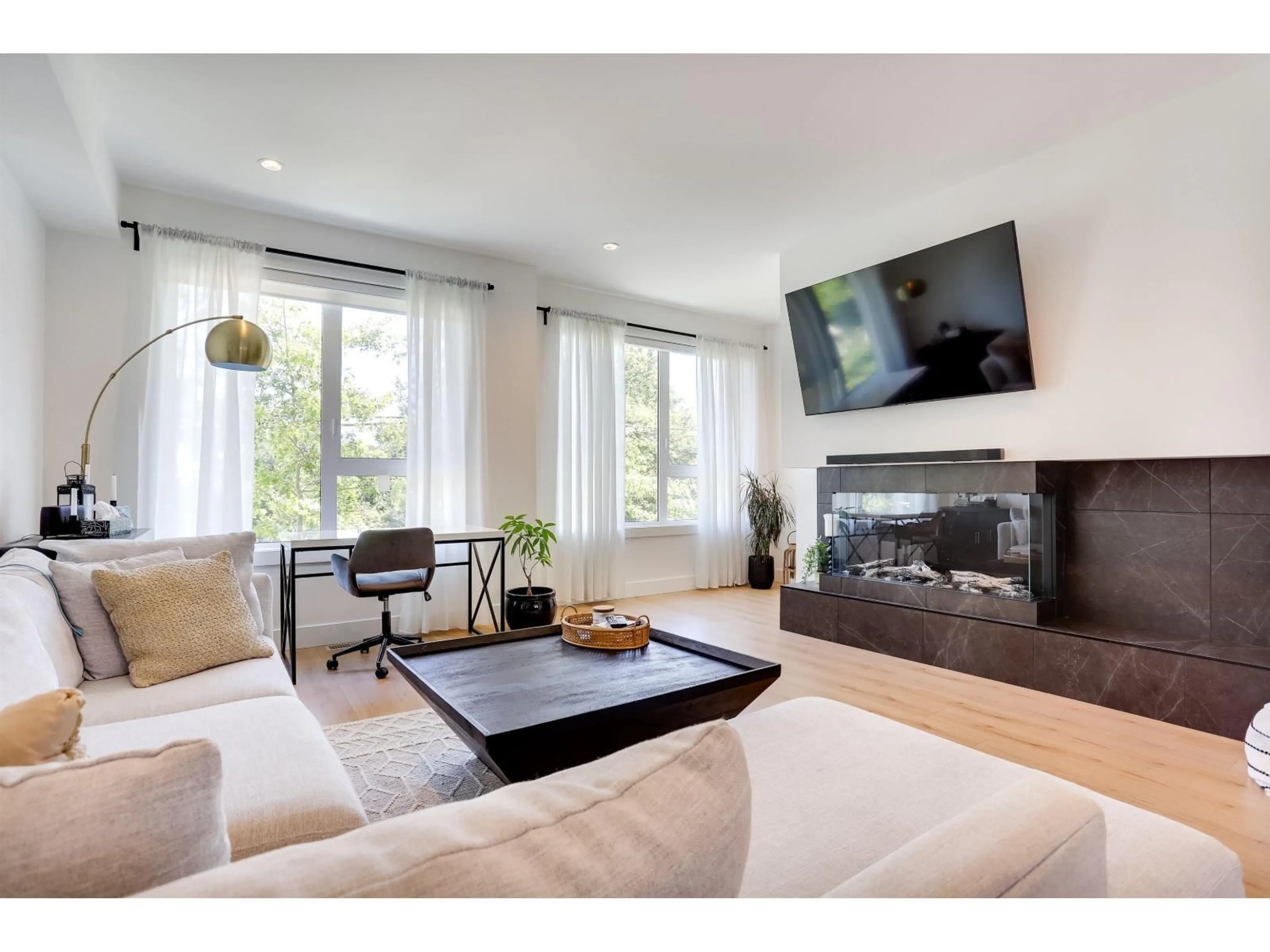 Living room with furniture, wood/laminate floor for 26 - 15030 28 AVENUE, Surrey British Columbia V4P0H3