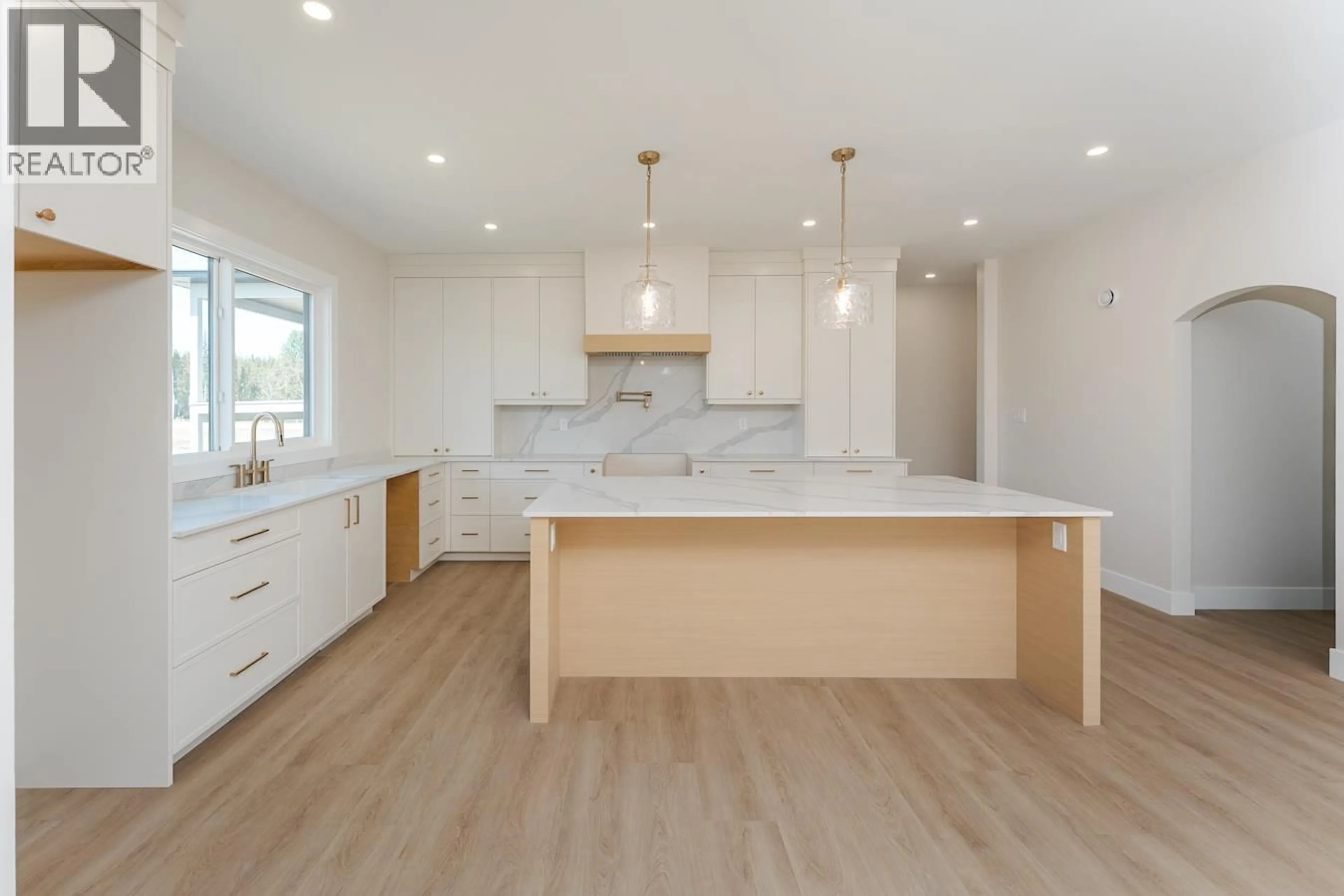 Open concept kitchen, wood/laminate floor for 5089 HEADLANDS HEIGHTS, Prince George British Columbia V2N0K6