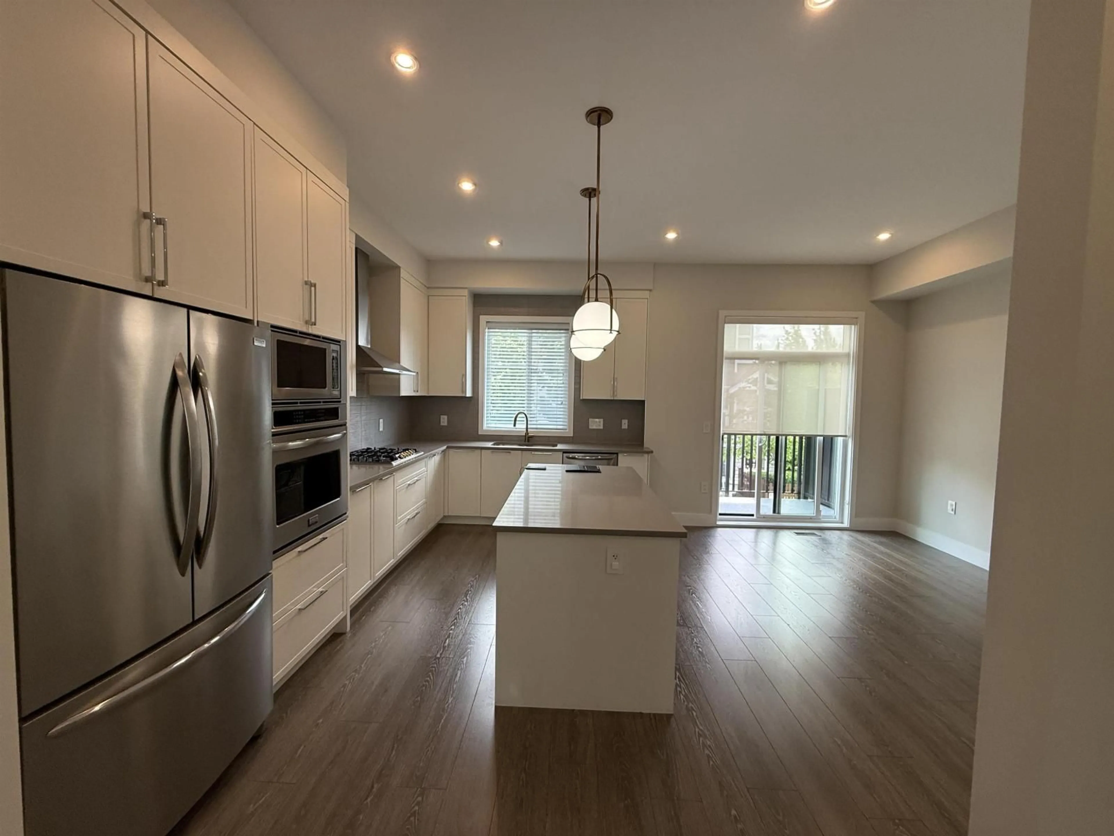 Open concept kitchen, wood/laminate floor for 2 - 19133 73 AVENUE, Surrey British Columbia V4N6S9