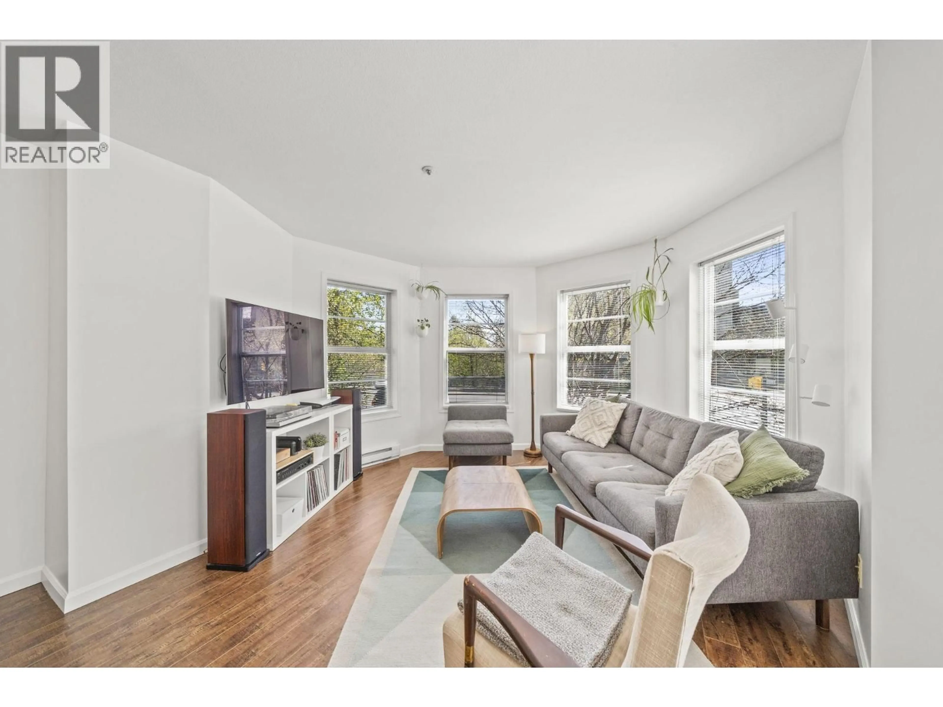 Living room with furniture, wood/laminate floor for 204 - 1883 10TH AVENUE, Vancouver British Columbia V5N1X8