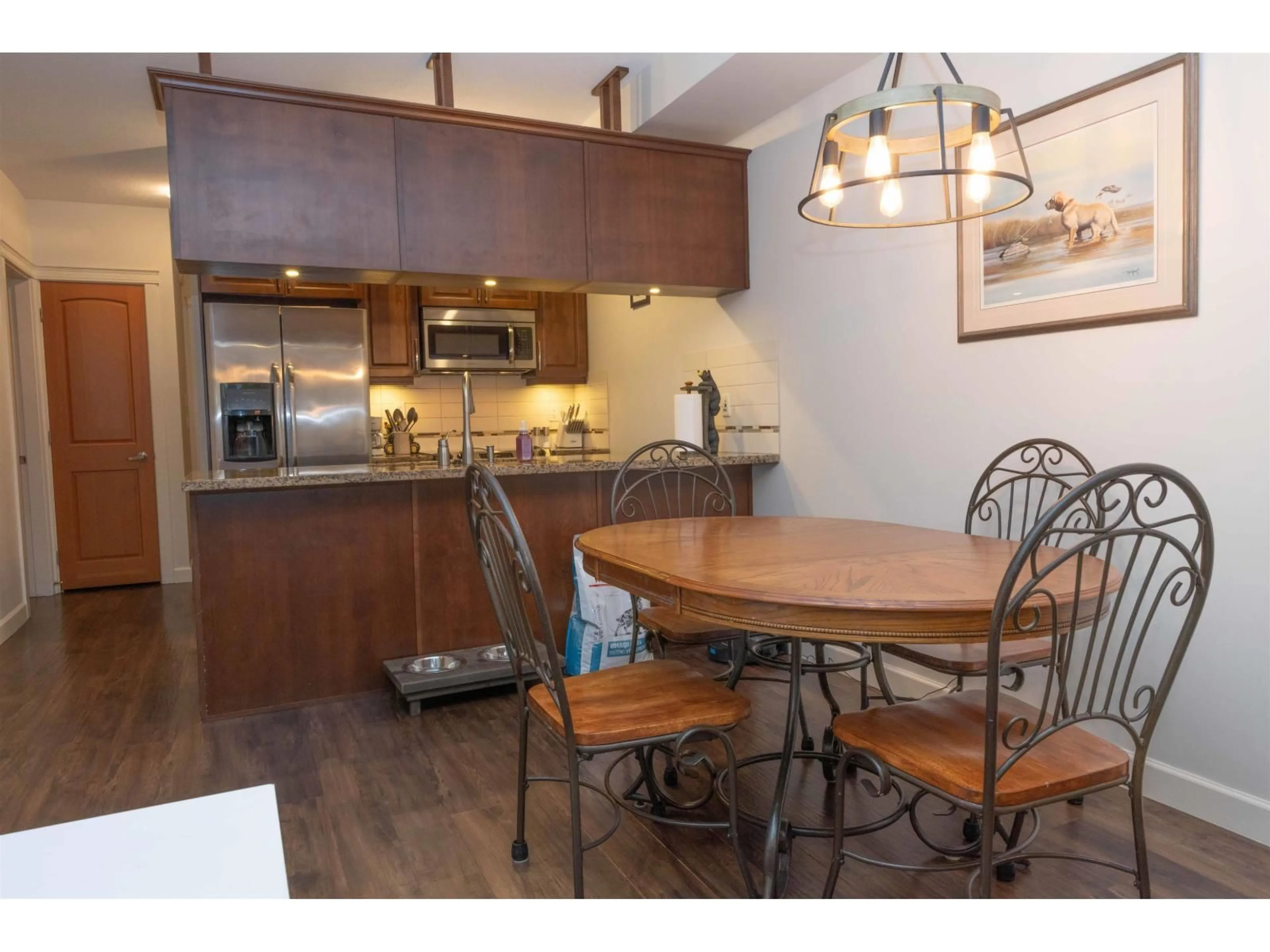 Open concept kitchen, wood/laminate floor for 107 - 8328 207A STREET, Langley British Columbia V2Y0K5