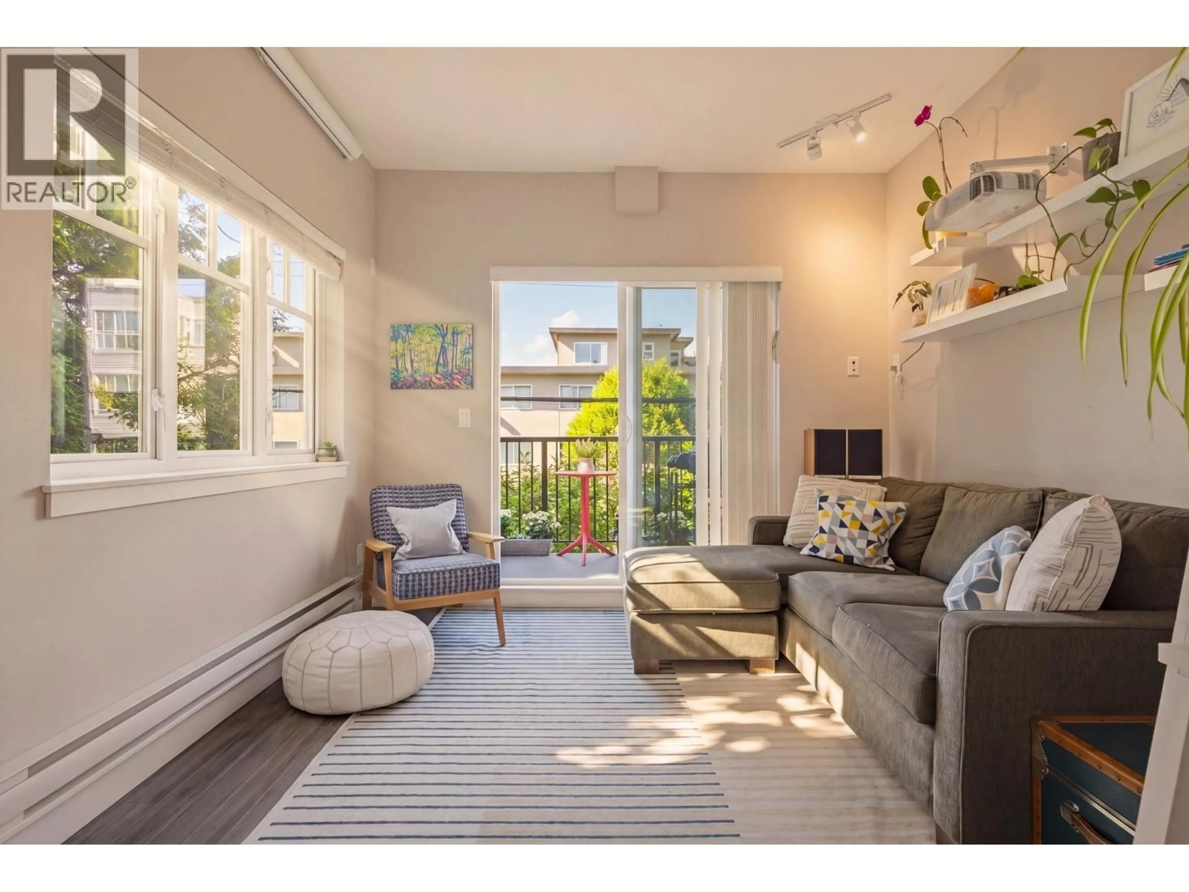 Living room with furniture, unknown for 215 - 2273 TRIUMPH STREET, Vancouver British Columbia V5L1L2