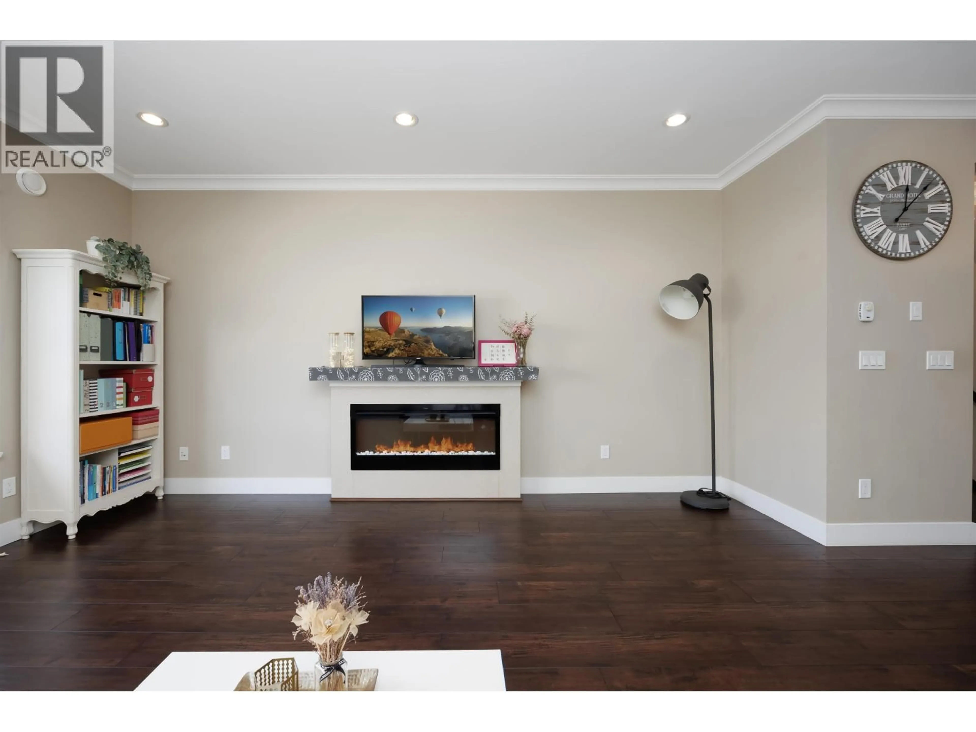 Living room with furniture, wood/laminate floor for 13 - 7551 NO. 2 ROAD, Richmond British Columbia V7L3L7