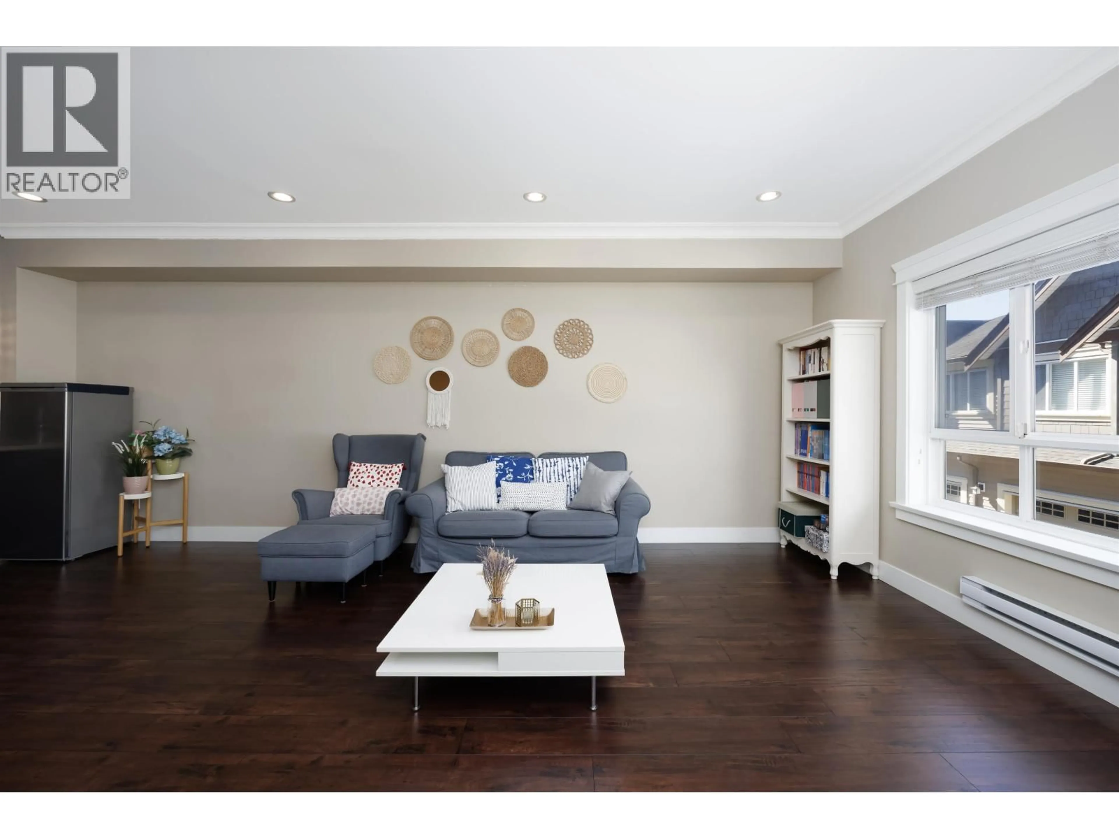 Living room with furniture, wood/laminate floor for 13 - 7551 NO. 2 ROAD, Richmond British Columbia V7L3L7