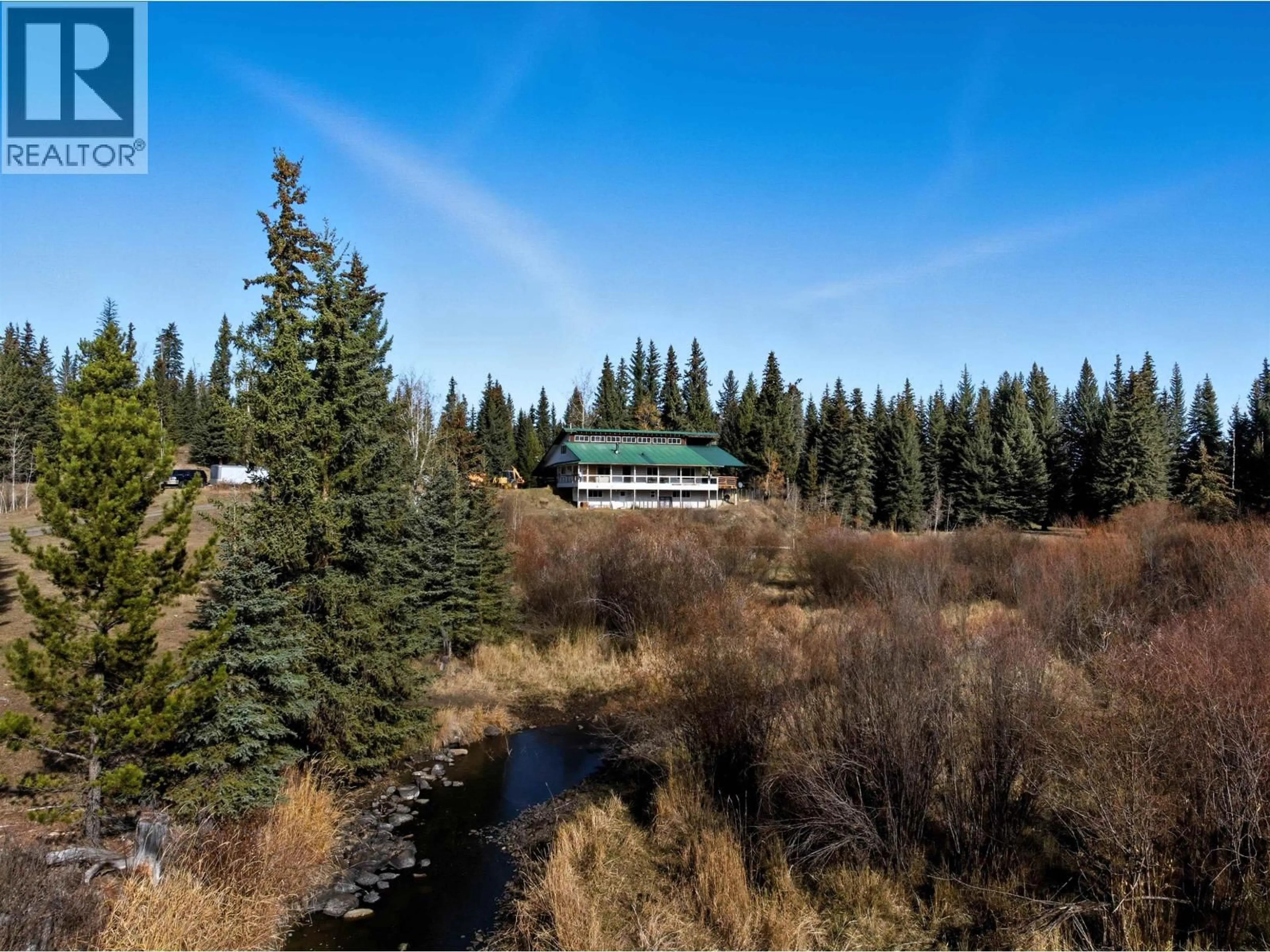 A pic from outside/outdoor area/front of a property/back of a property/a pic from drone, forest/trees view for 6330 & - 6391 HOUSEMAN ROAD, 100 Mile House British Columbia V0K1G0