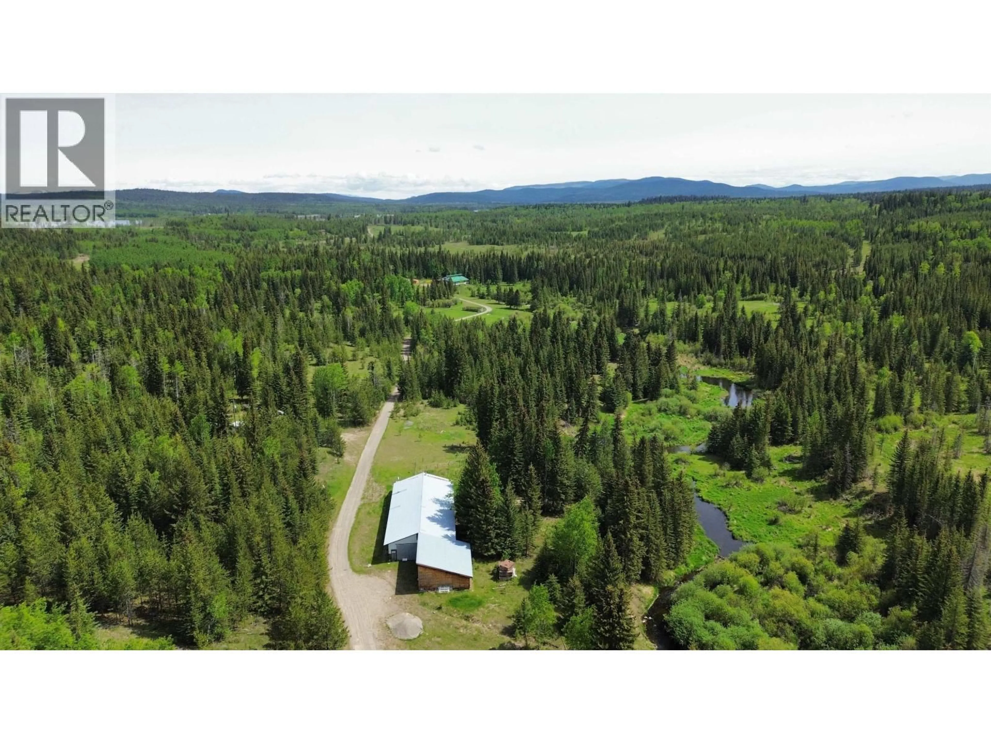 A pic from outside/outdoor area/front of a property/back of a property/a pic from drone, forest/trees view for 6330 & - 6391 HOUSEMAN ROAD, 100 Mile House British Columbia V0K1G0