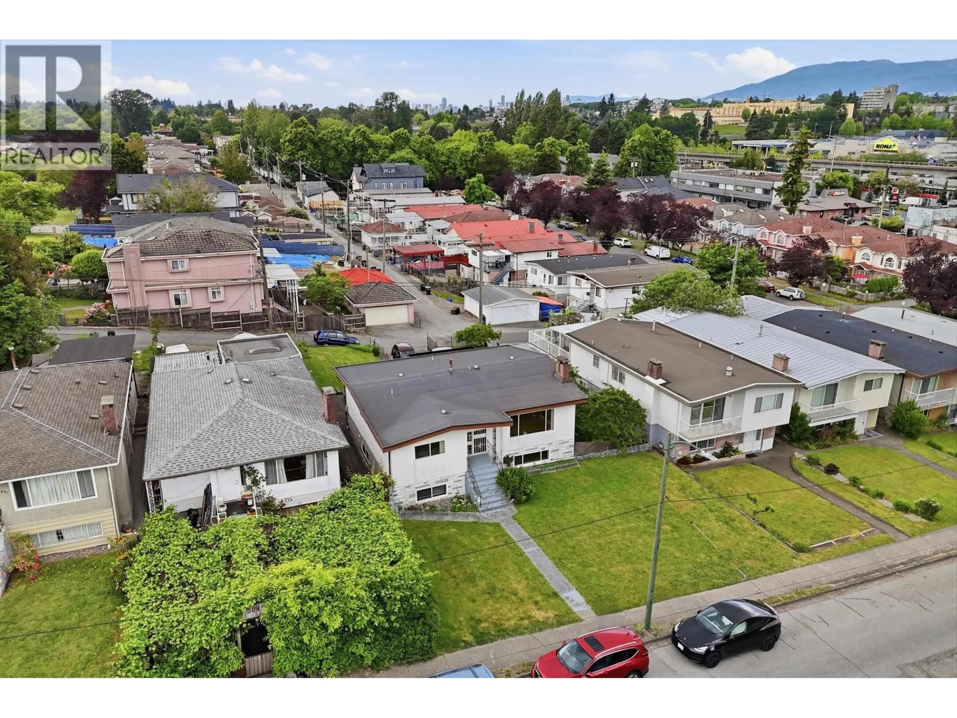 A pic from outside/outdoor area/front of a property/back of a property/a pic from drone, mountain view for 3063 RENFREW STREET, Vancouver British Columbia V5M3K7