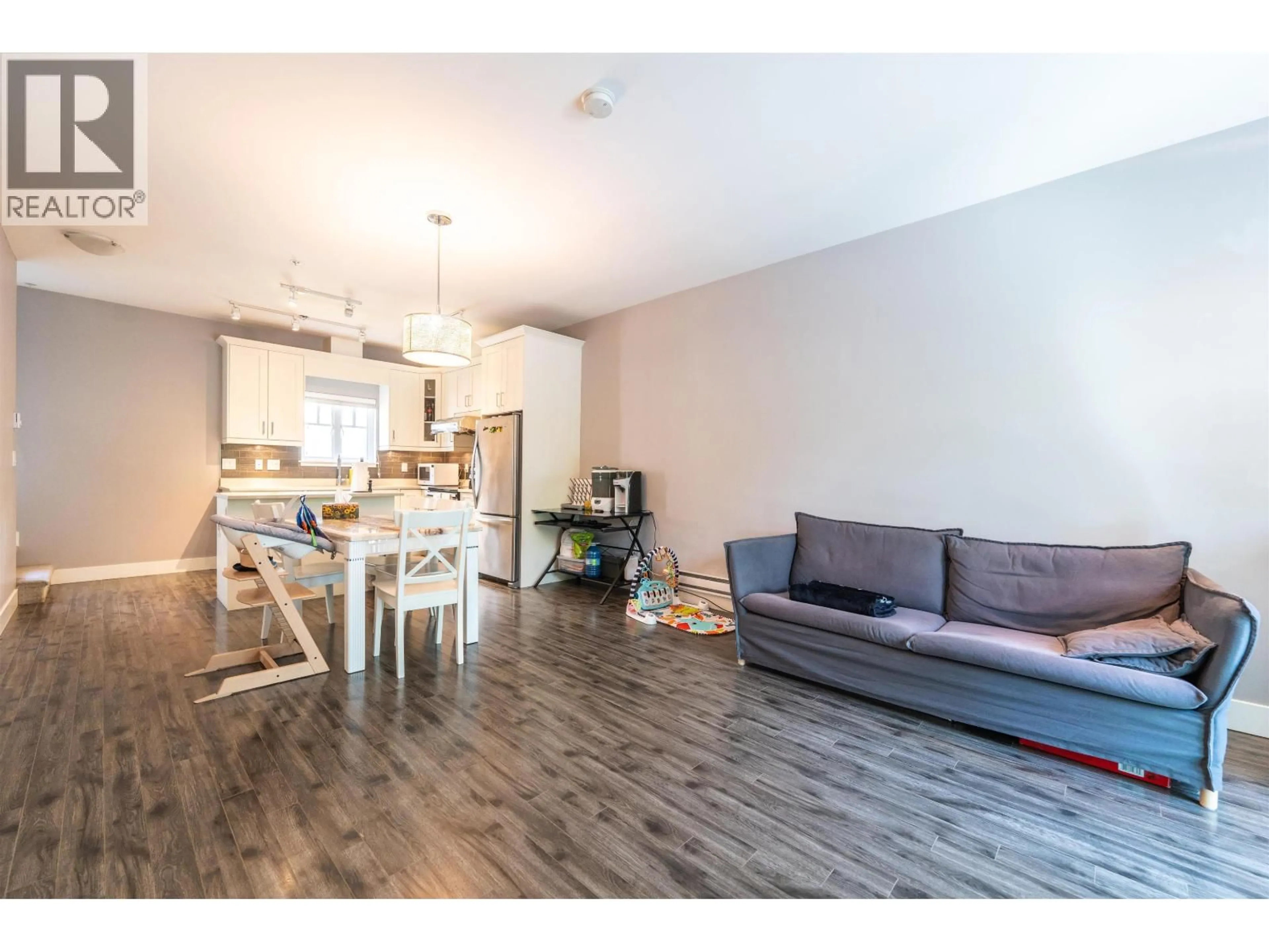 Open concept kitchen, wood/laminate floor for 205 - 2263 TRIUMPH STREET, Vancouver British Columbia V5L1L2