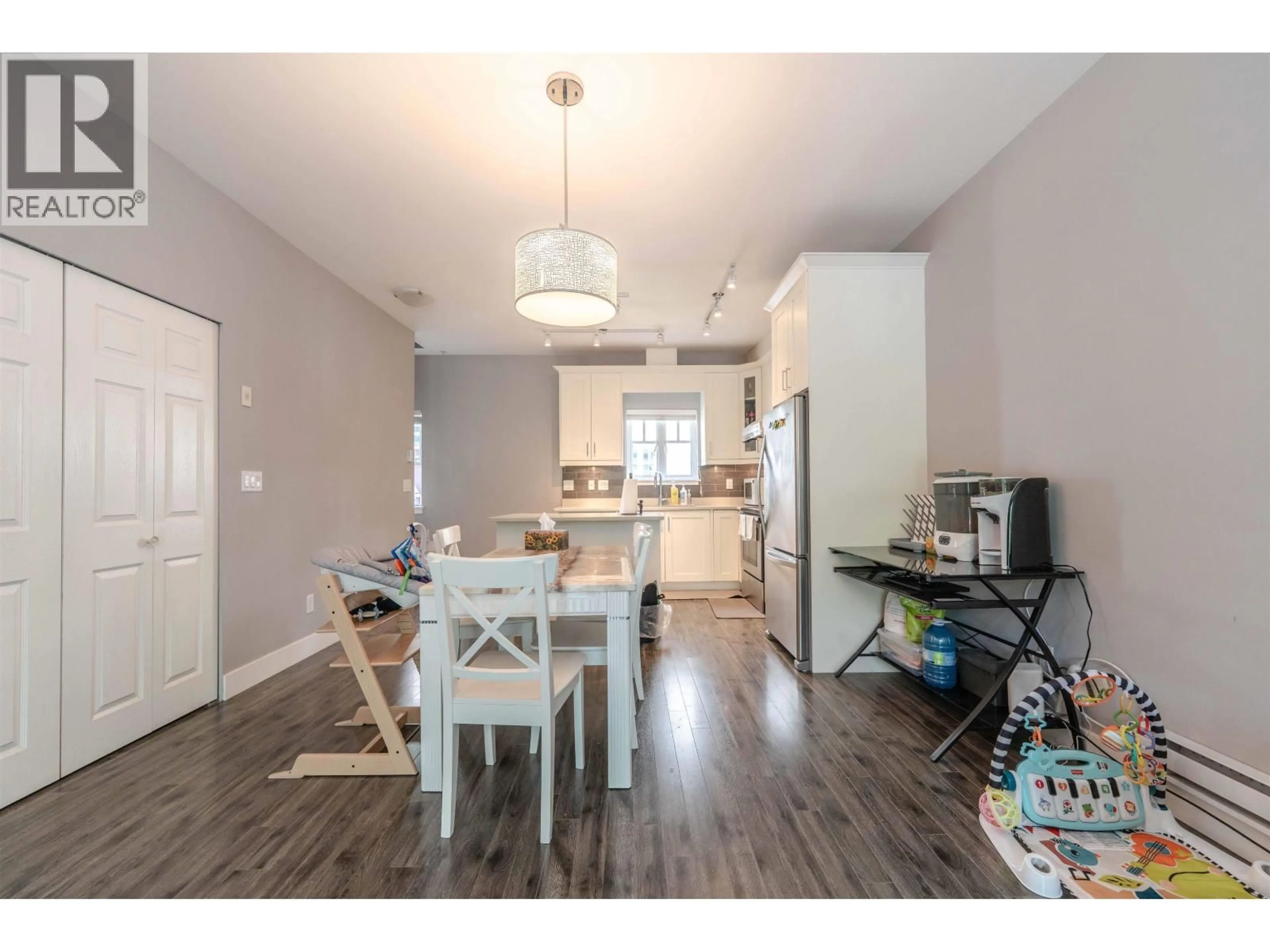 Open concept kitchen, wood/laminate floor for 205 - 2263 TRIUMPH STREET, Vancouver British Columbia V5L1L2