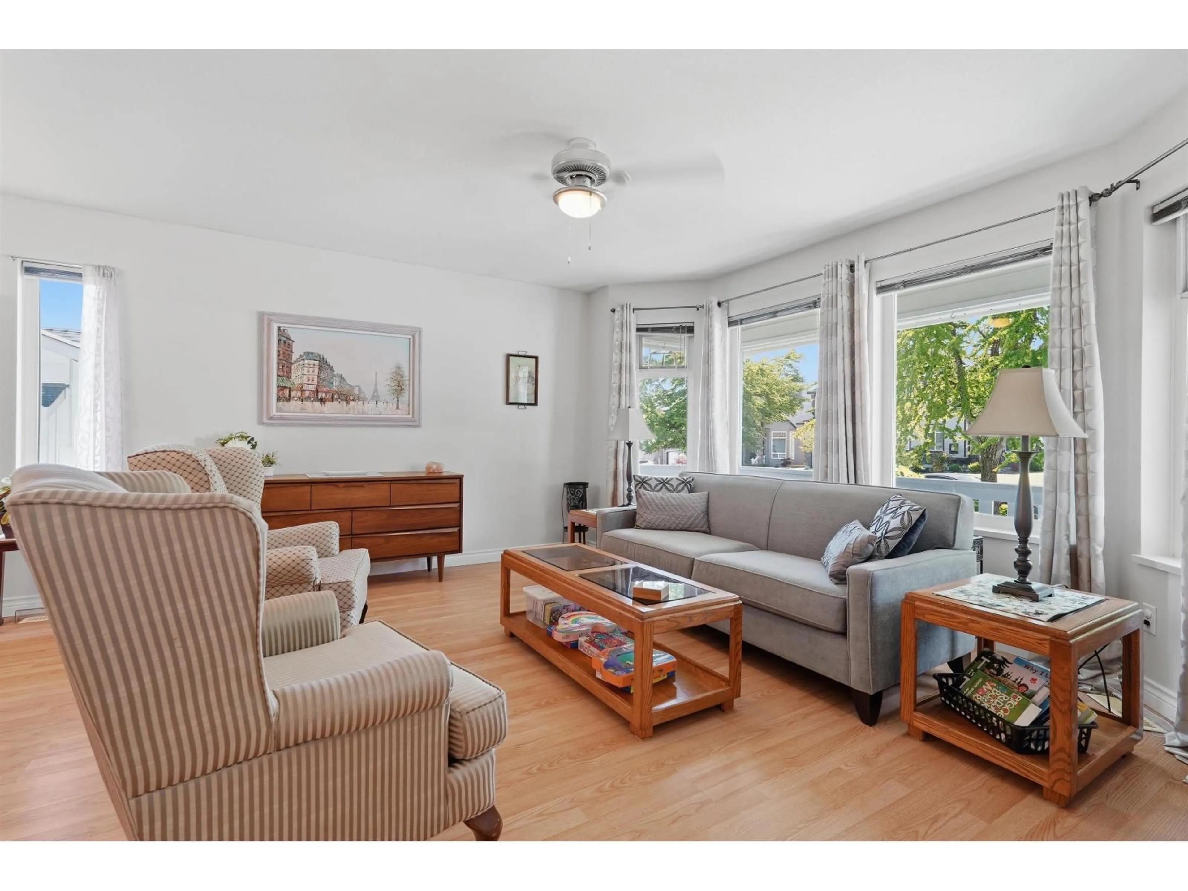 Living room with furniture, wood/laminate floor for 27033 26A AVENUE, Langley British Columbia V4W3V5