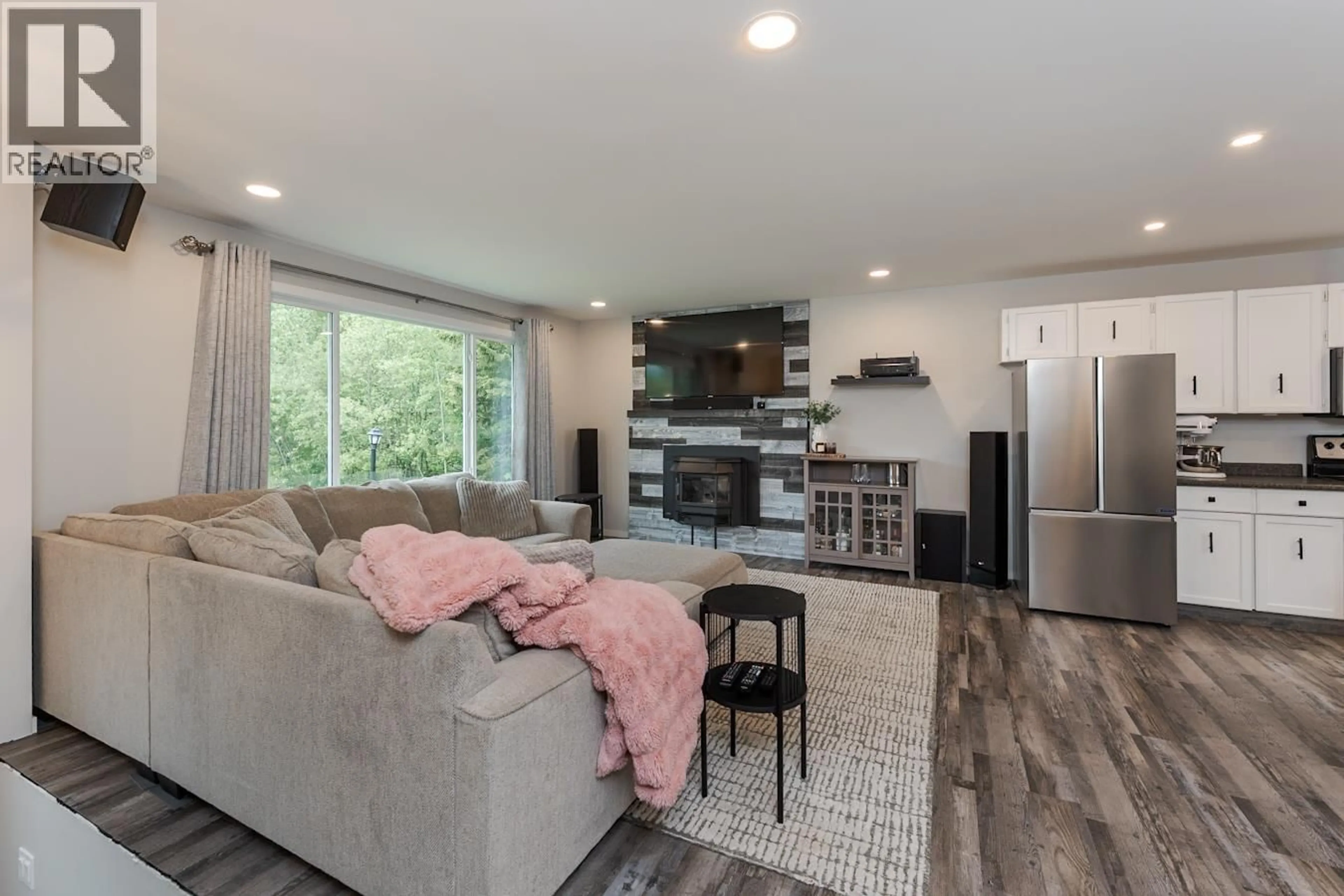 Living room with furniture, wood/laminate floor for 5698 HEPTING ROAD, Prince George British Columbia V2K3E1