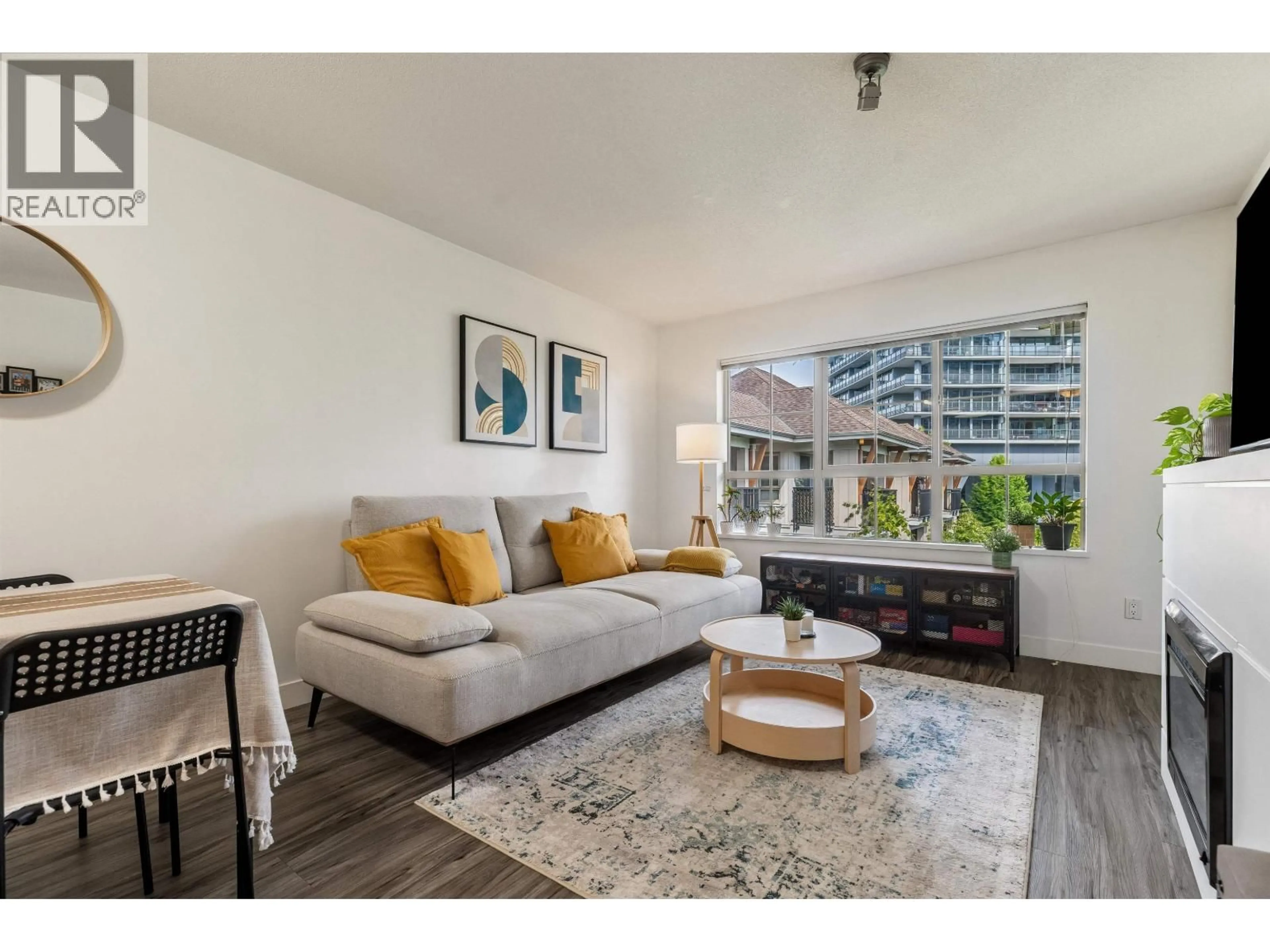 Living room with furniture, wood/laminate floor for 408 - 2088 BETA AVENUE, Burnaby British Columbia V5C0C8