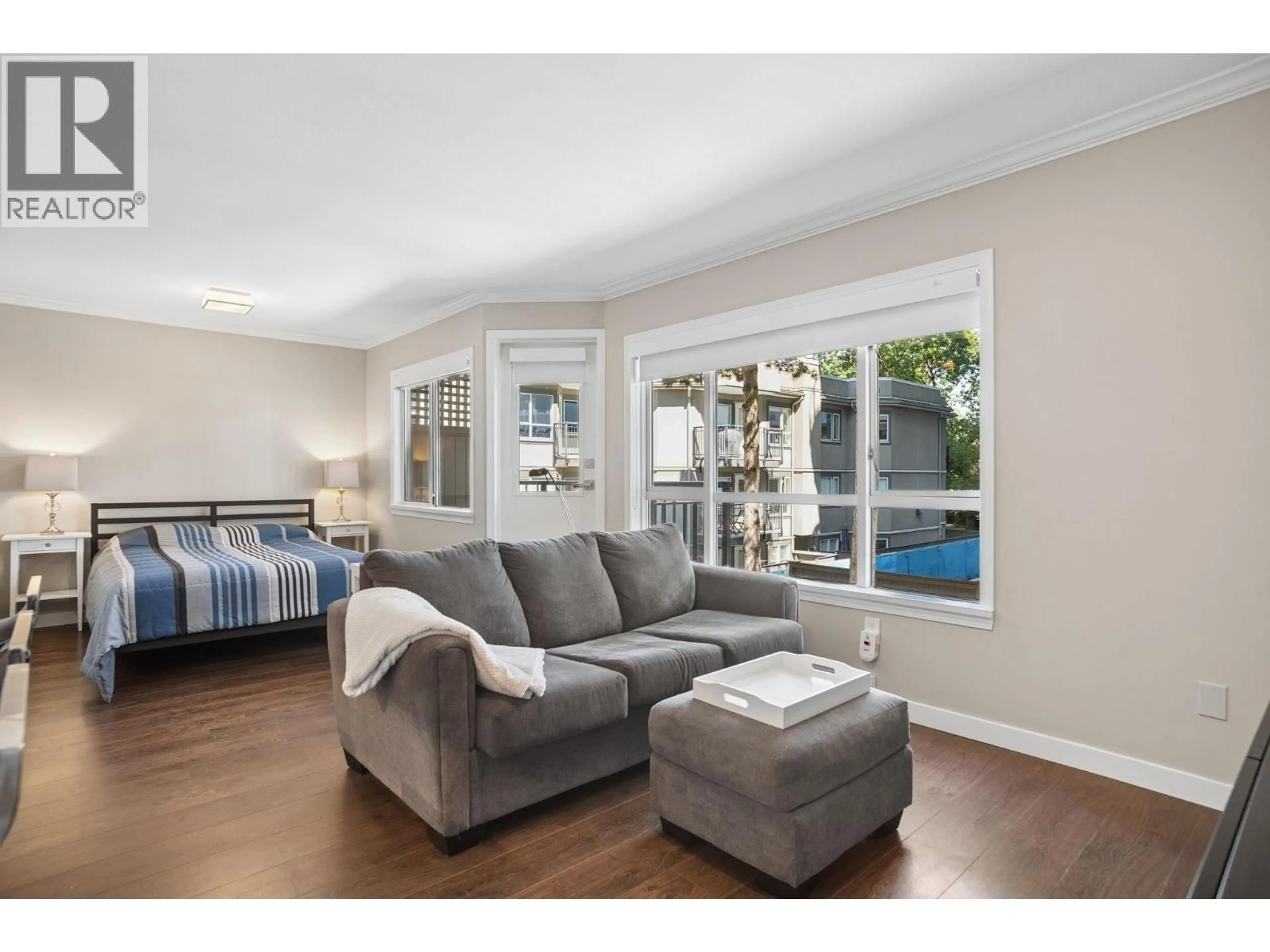 Living room with furniture, wood/laminate floor for 202 - 555 14TH AVENUE, Vancouver British Columbia V5Z4G8