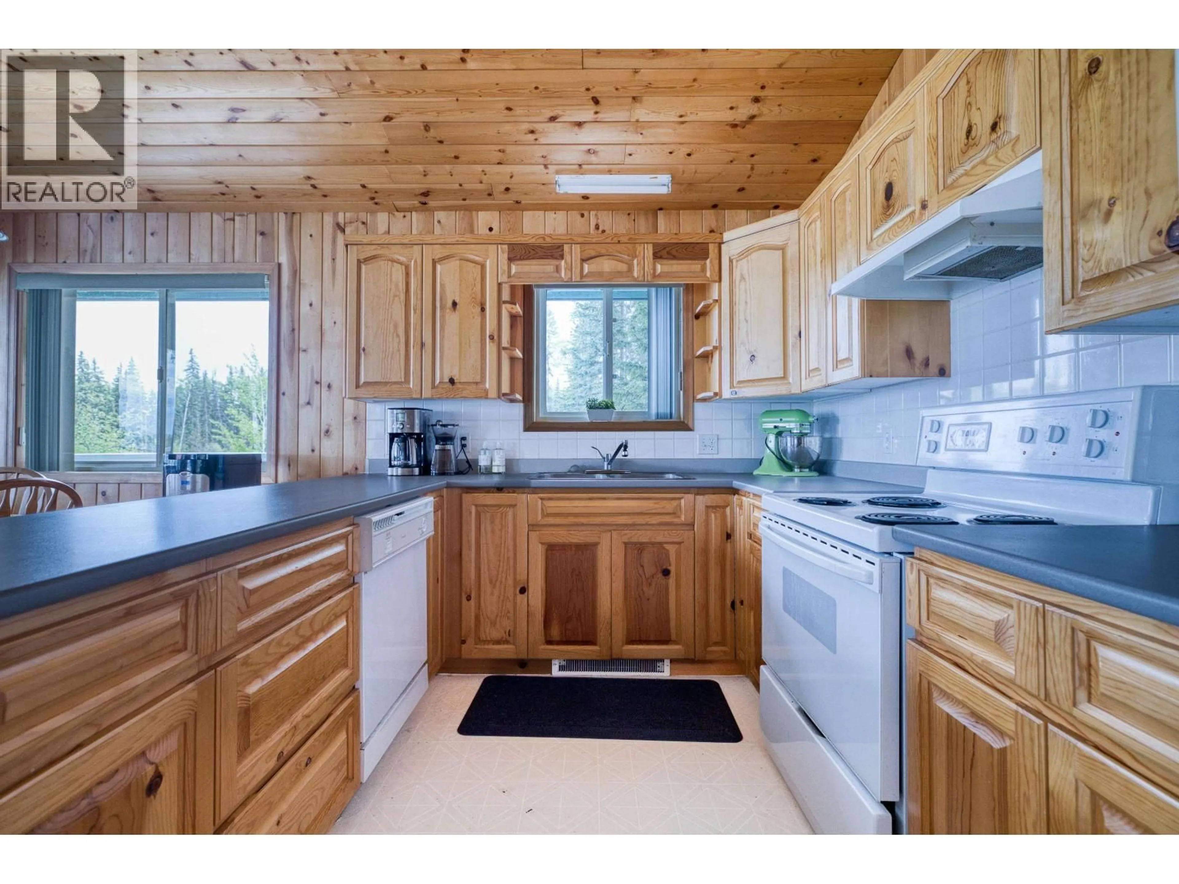 Standard kitchen, wood/laminate floor for 7607 NORTH POINT ROAD, 100 Mile House British Columbia V0K1X1