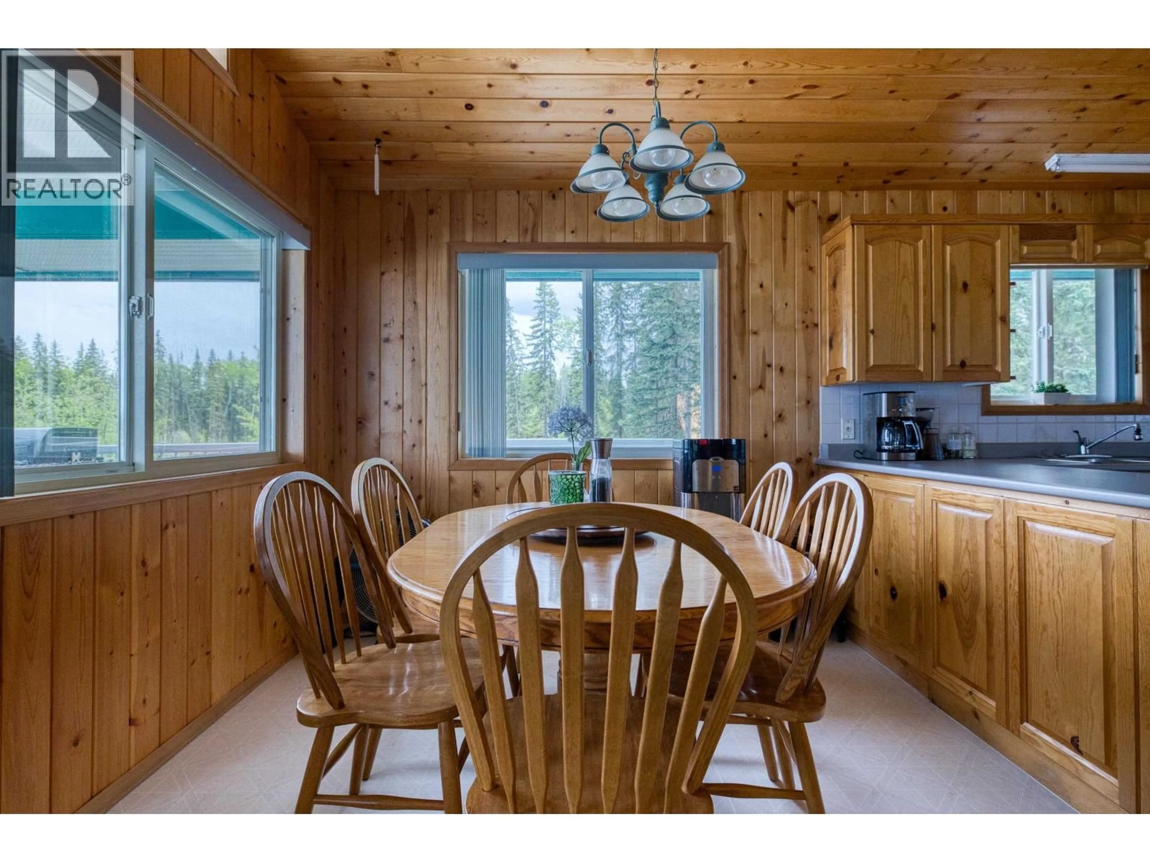 Dining room, wood/laminate floor for 7607 NORTH POINT ROAD, 100 Mile House British Columbia V0K1X1