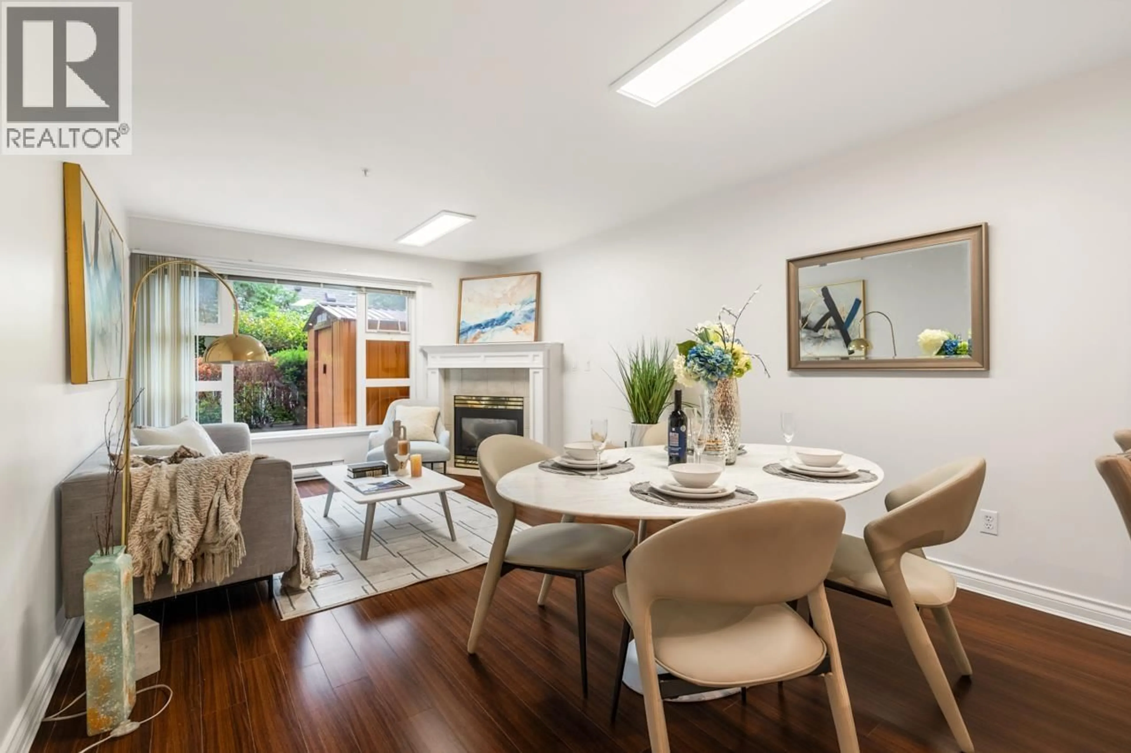 Living room with furniture, wood/laminate floor for 105 - 988 54TH AVENUE, Vancouver British Columbia V6P1M9