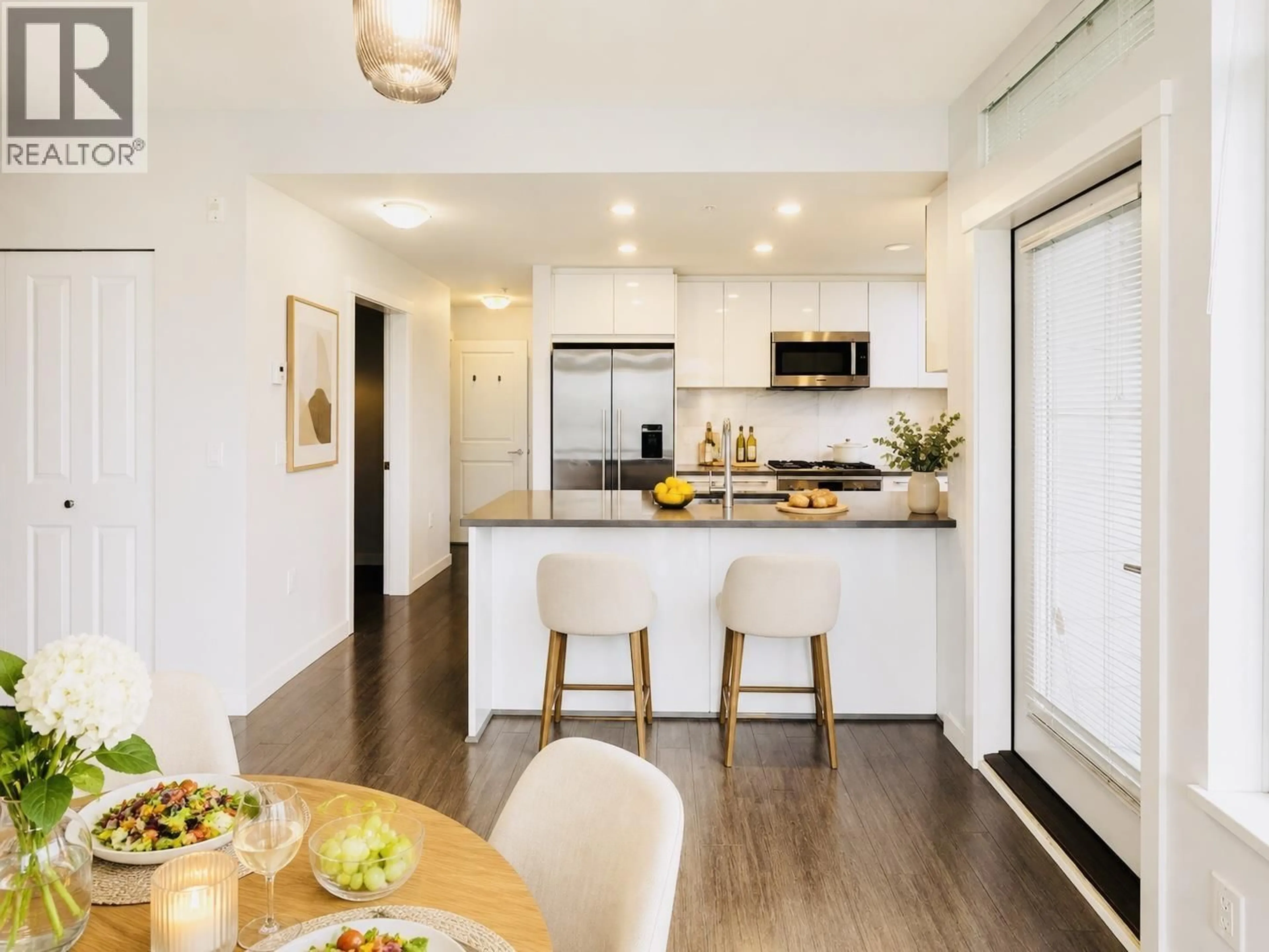 Open concept kitchen, wood/laminate floor for 302 - 3263 PIERVIEW CRESCENT, Vancouver British Columbia V5S0C3