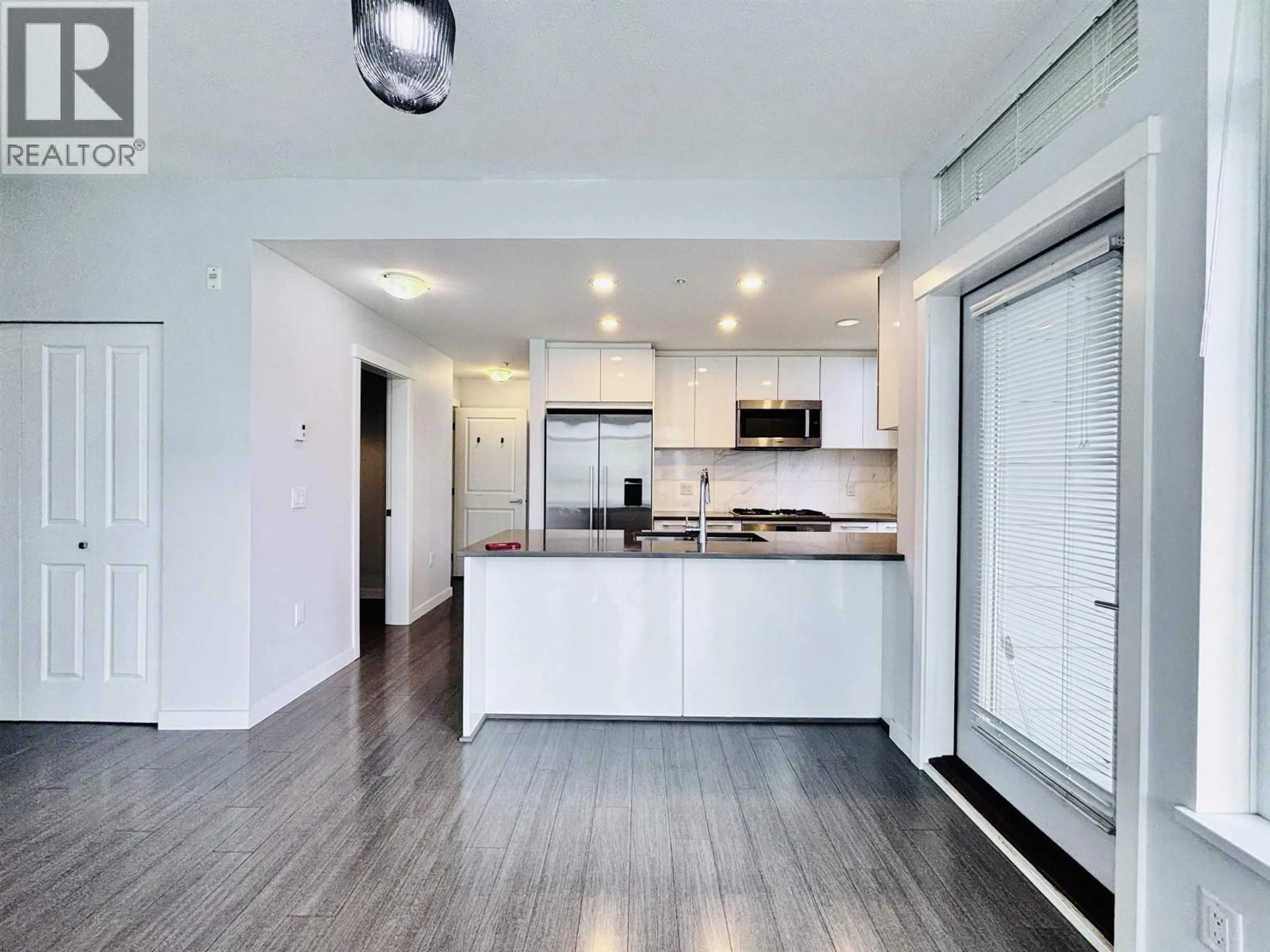 Open concept kitchen, wood/laminate floor for 302 - 3263 PIERVIEW CRESCENT, Vancouver British Columbia V5S0C3