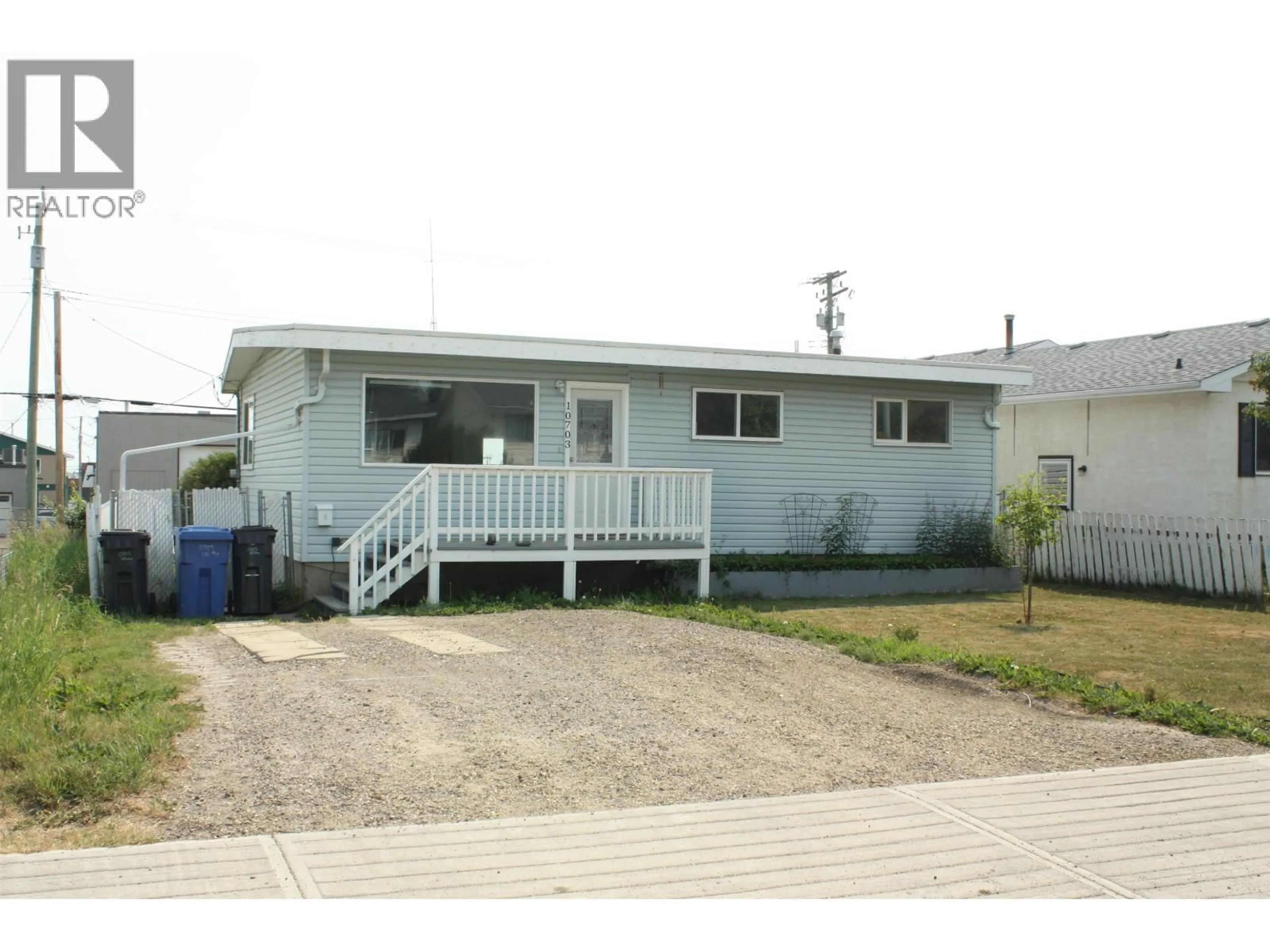 Home with vinyl exterior material, street for 10703 102 AVENUE, Fort St. John British Columbia V1J2E9