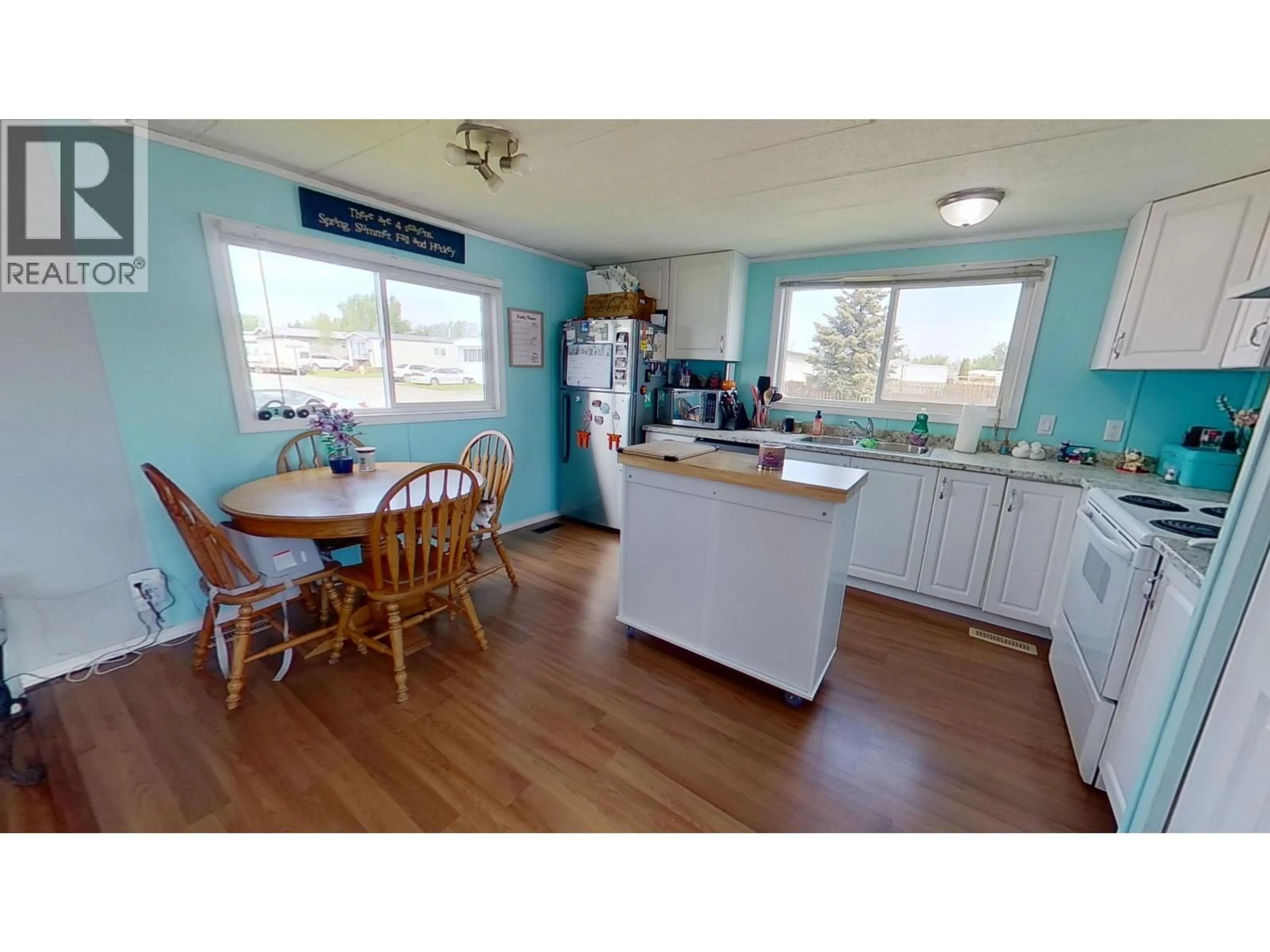 Open concept kitchen, wood/laminate floor for 147 - 9207 82 STREET, Fort St. John British Columbia V1J5G5