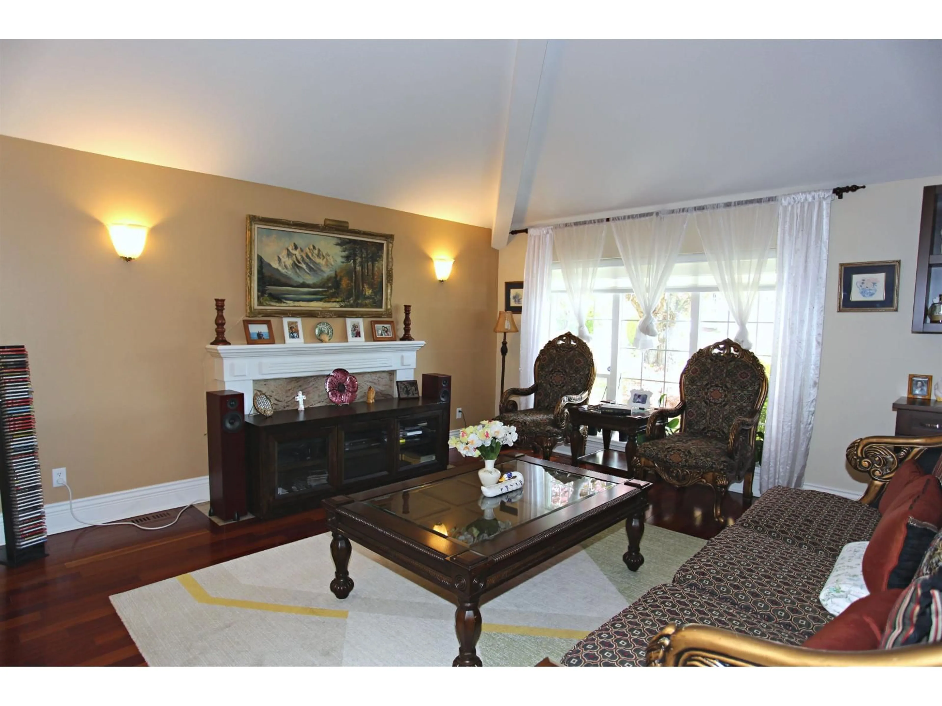 Living room with furniture, wood/laminate floor for 8265 148B STREET, Surrey British Columbia V3S7R9