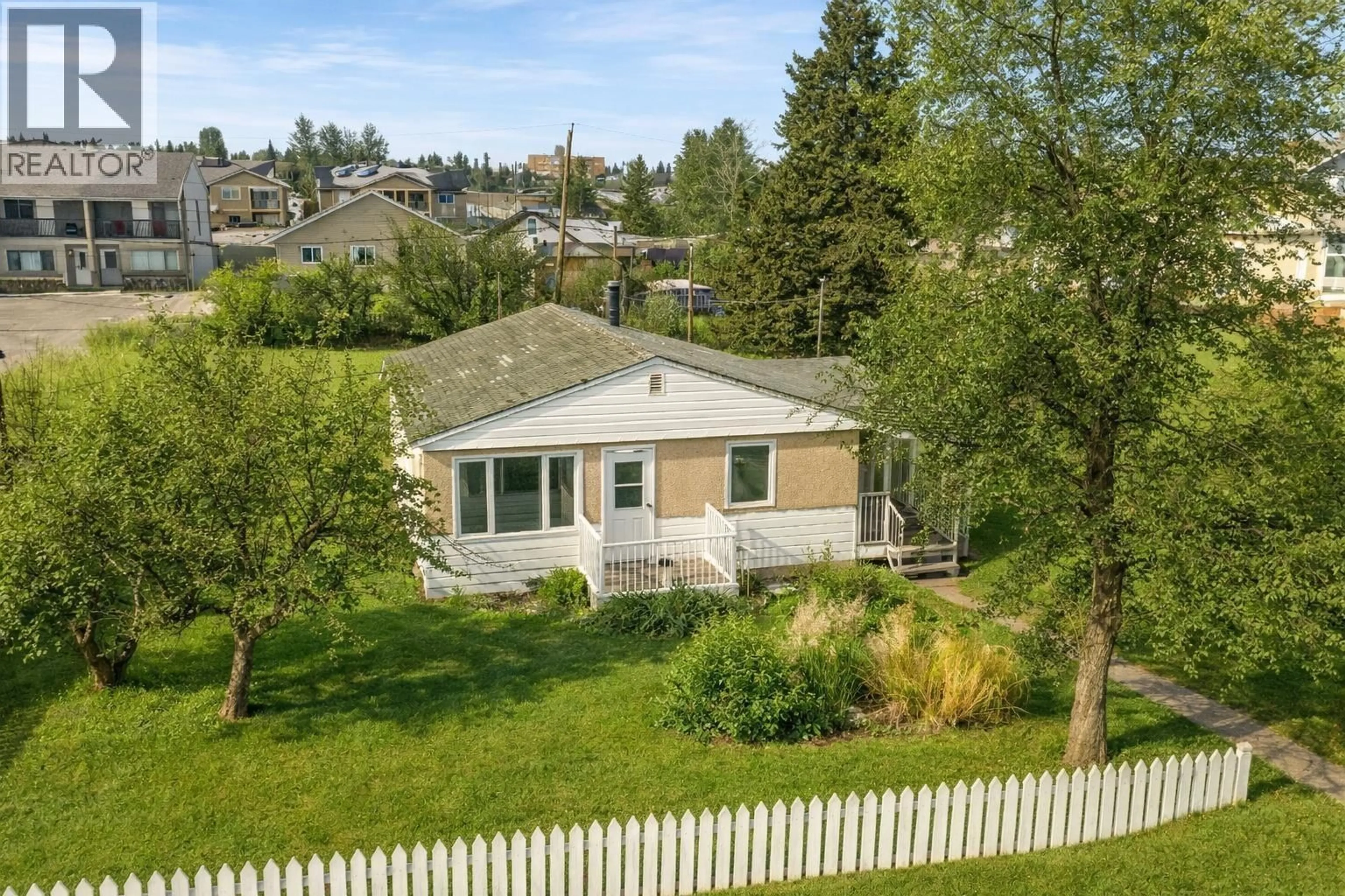 A pic from outside/outdoor area/front of a property/back of a property/a pic from drone, unknown for 10220 96 AVENUE, Fort St. John British Columbia V1J1L4