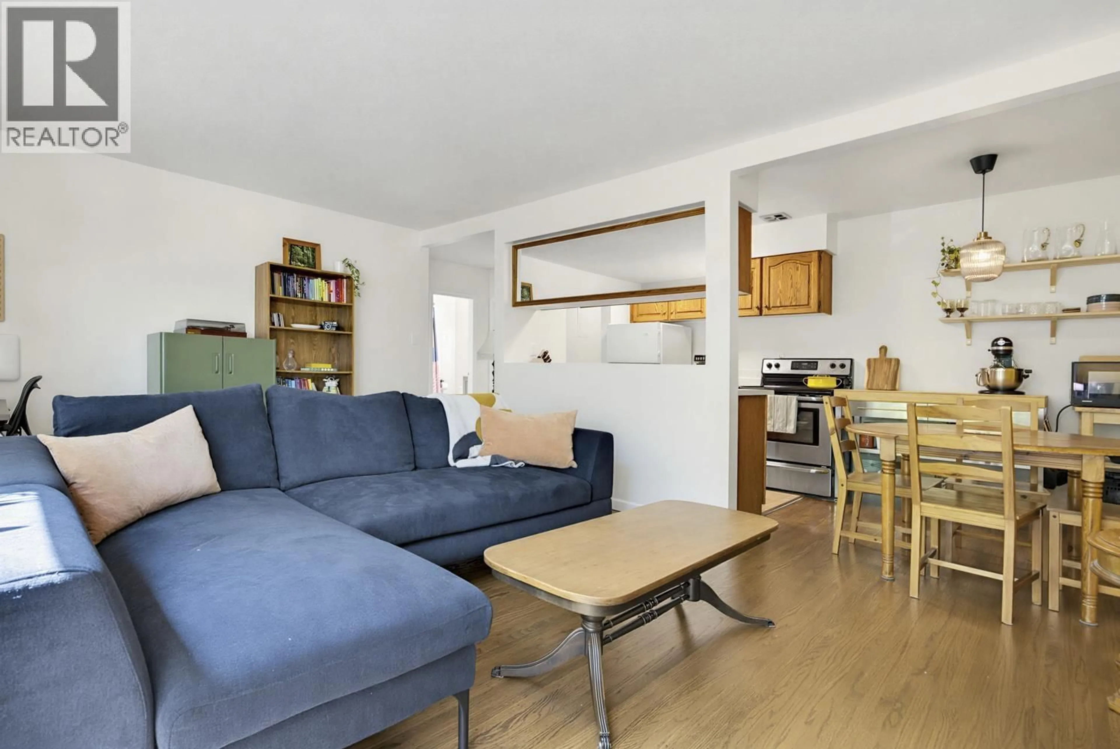 Living room with furniture, wood/laminate floor for 215 - 8680 FREMLIN STREET, Vancouver British Columbia V6P3X3