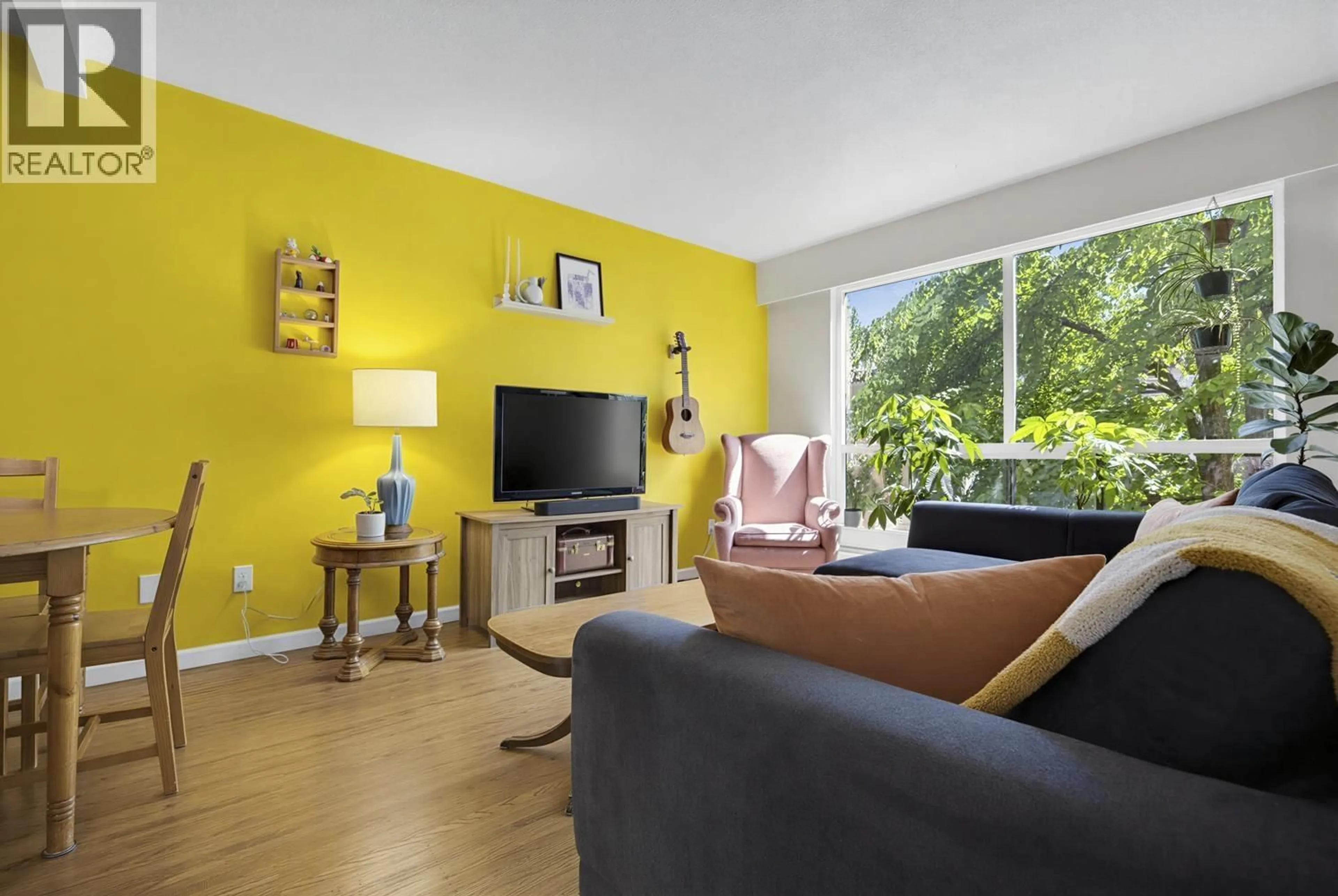 Living room with furniture, wood/laminate floor for 215 - 8680 FREMLIN STREET, Vancouver British Columbia V6P3X3