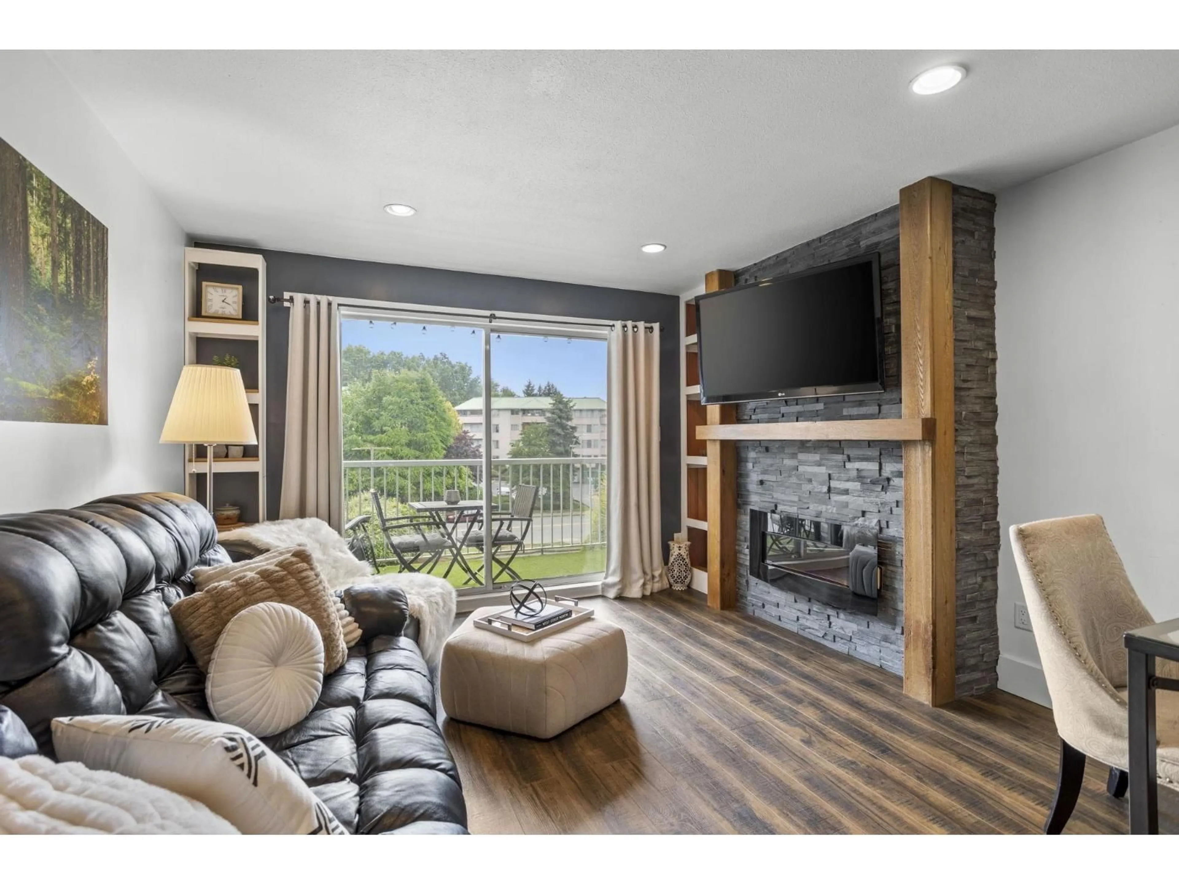 Living room with furniture, wood/laminate floor for 310 - 2780 WARE STREET, Abbotsford British Columbia V2S7C7