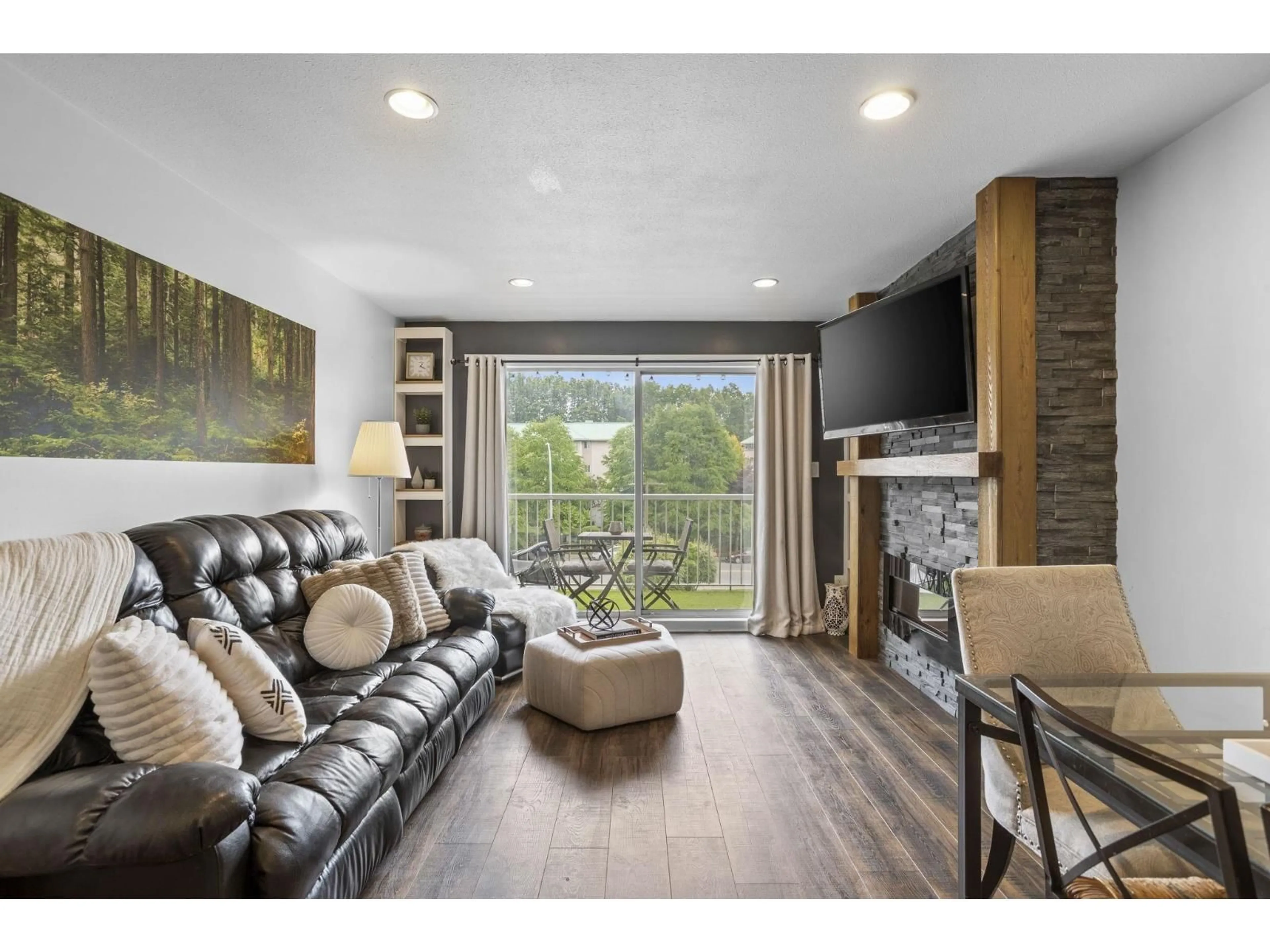 Living room with furniture, wood/laminate floor for 310 - 2780 WARE STREET, Abbotsford British Columbia V2S7C7