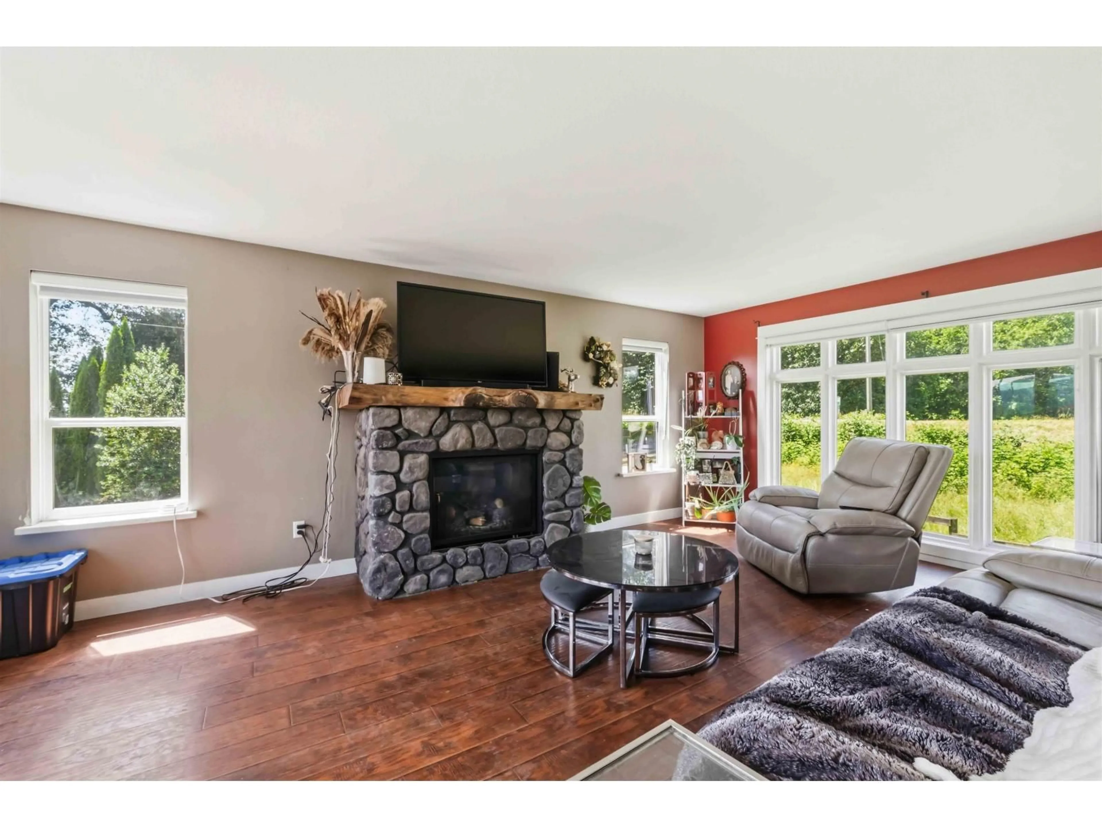 Living room with furniture, wood/laminate floor for 7310 KELLEHER STREET, Abbotsford British Columbia V3G1N2