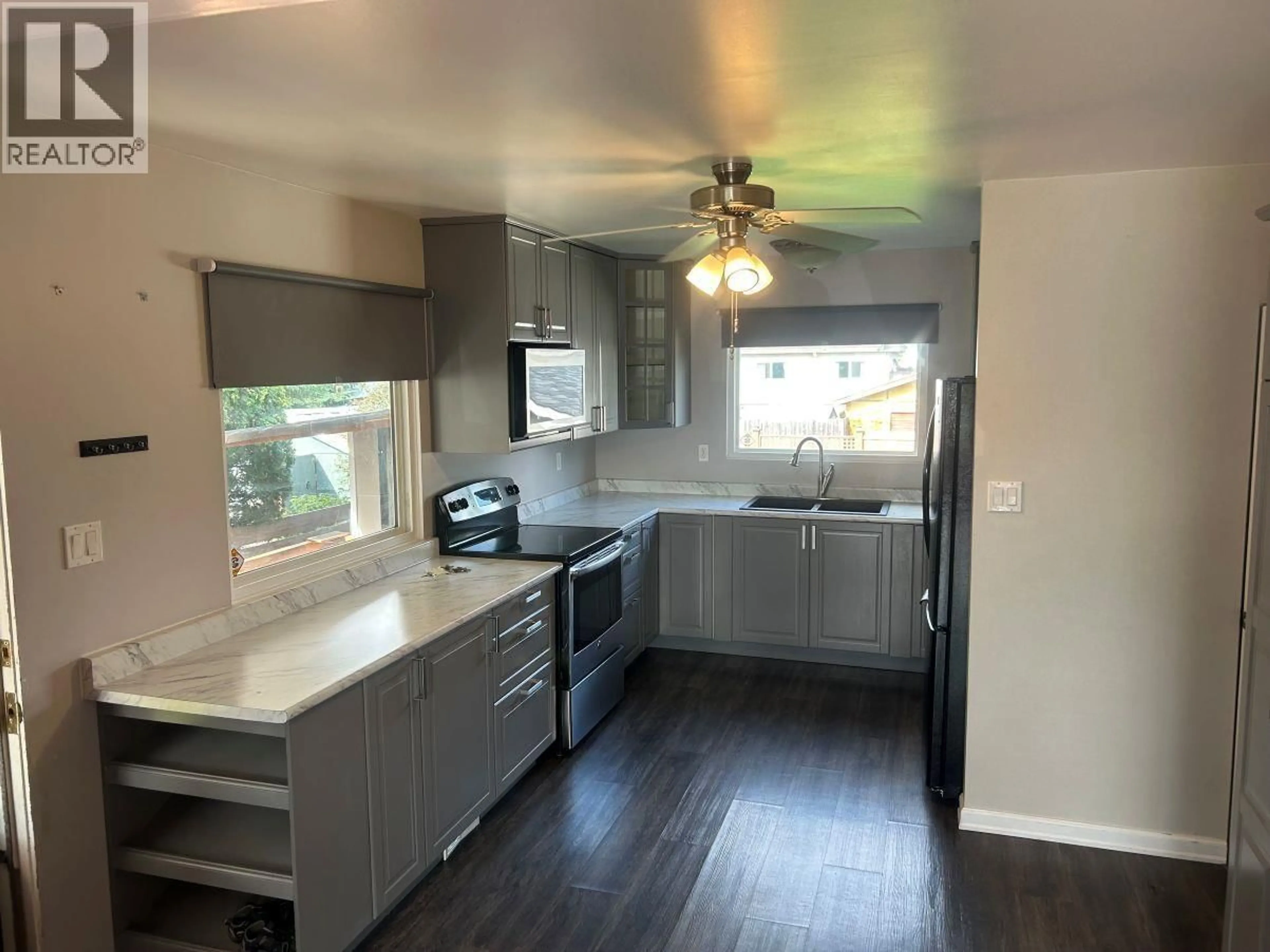 Open concept kitchen, wood/laminate floor for 373 NICHOLSON STREET, Prince George British Columbia V2M3L8