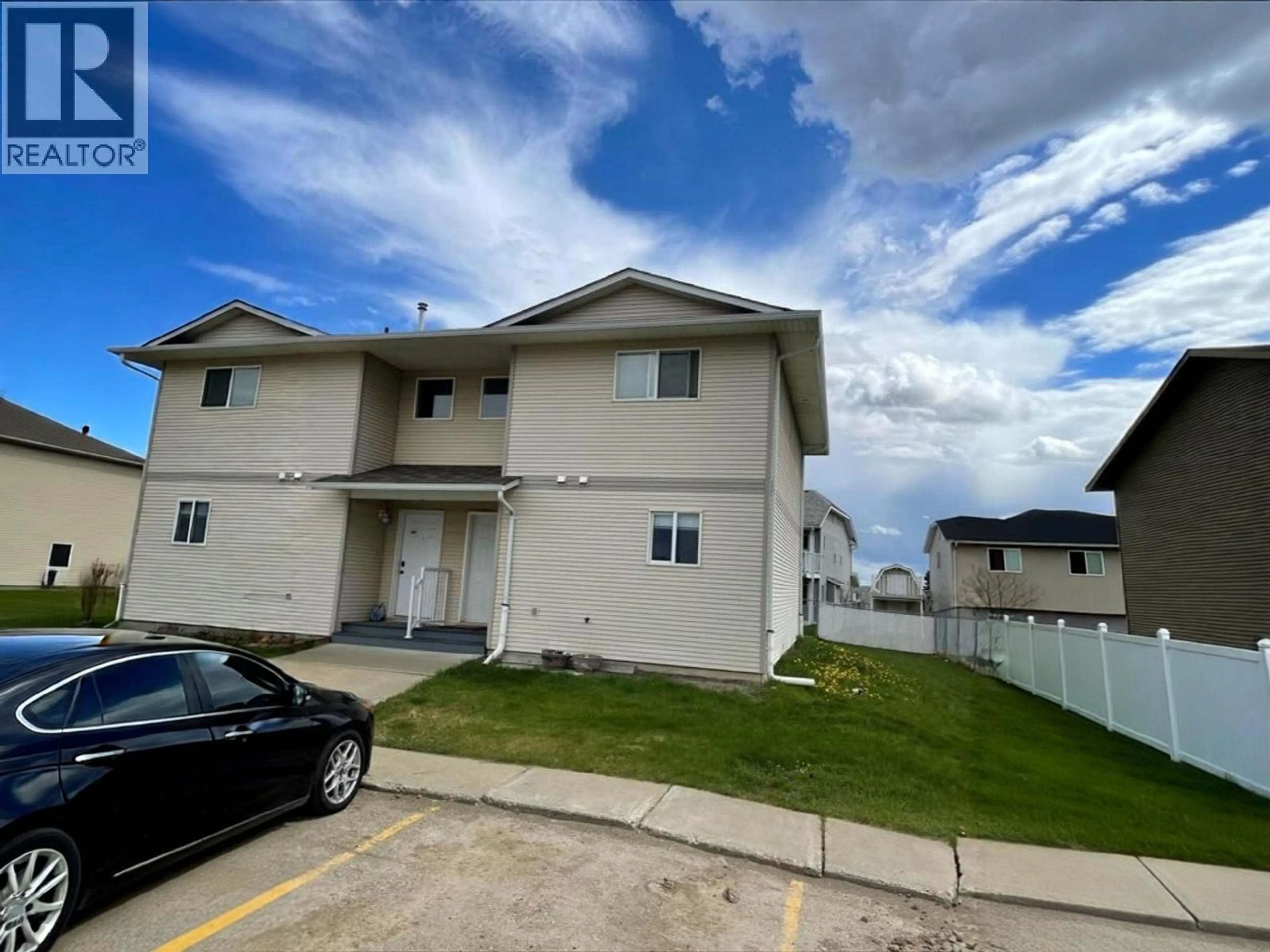 A pic from outside/outdoor area/front of a property/back of a property/a pic from drone, unknown for 405 - 9019 86 STREET, Fort St. John British Columbia V1J6X4
