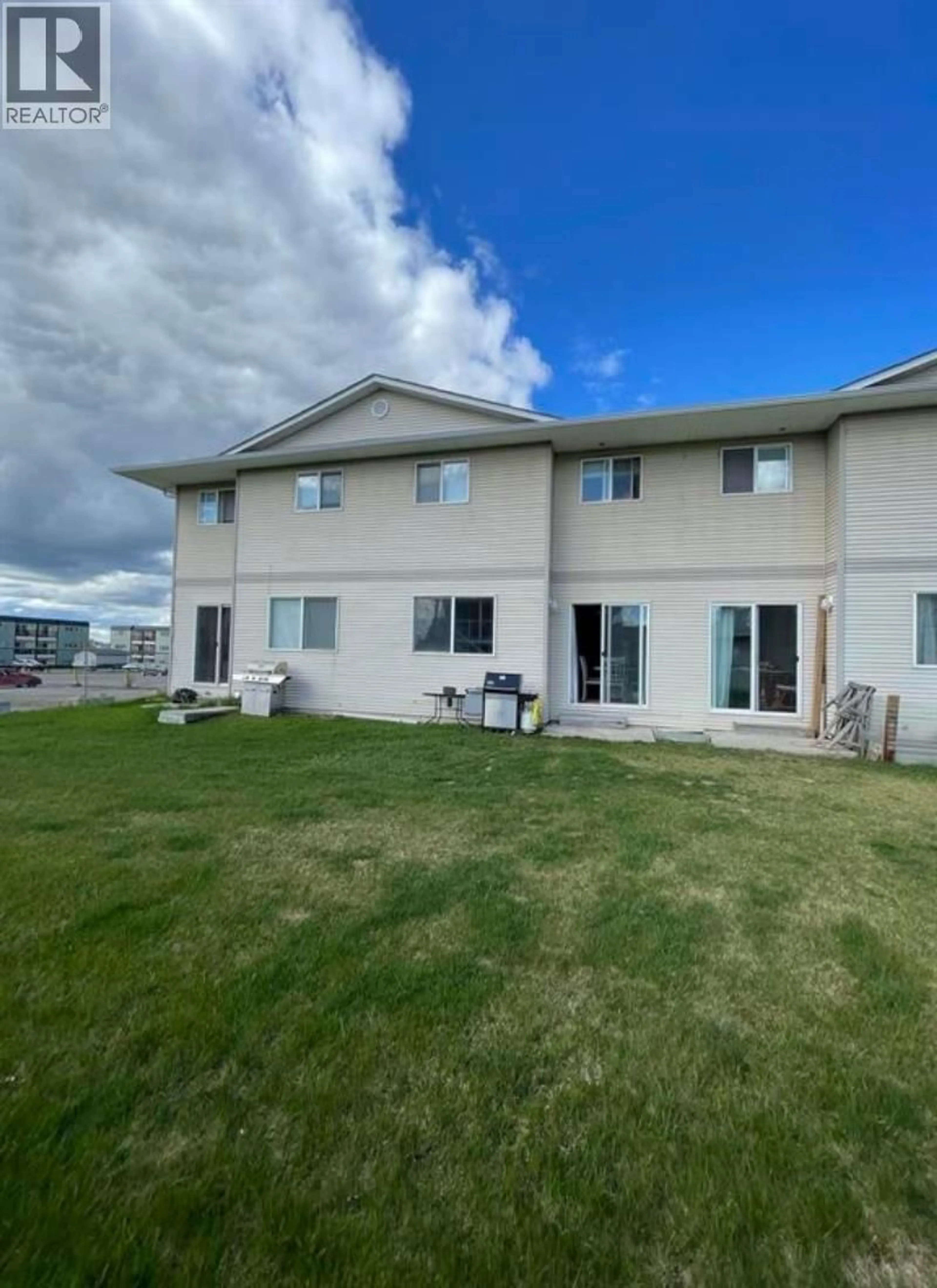 A pic from outside/outdoor area/front of a property/back of a property/a pic from drone, water/lake/river/ocean view for 405 - 9019 86 STREET, Fort St. John British Columbia V1J6X4