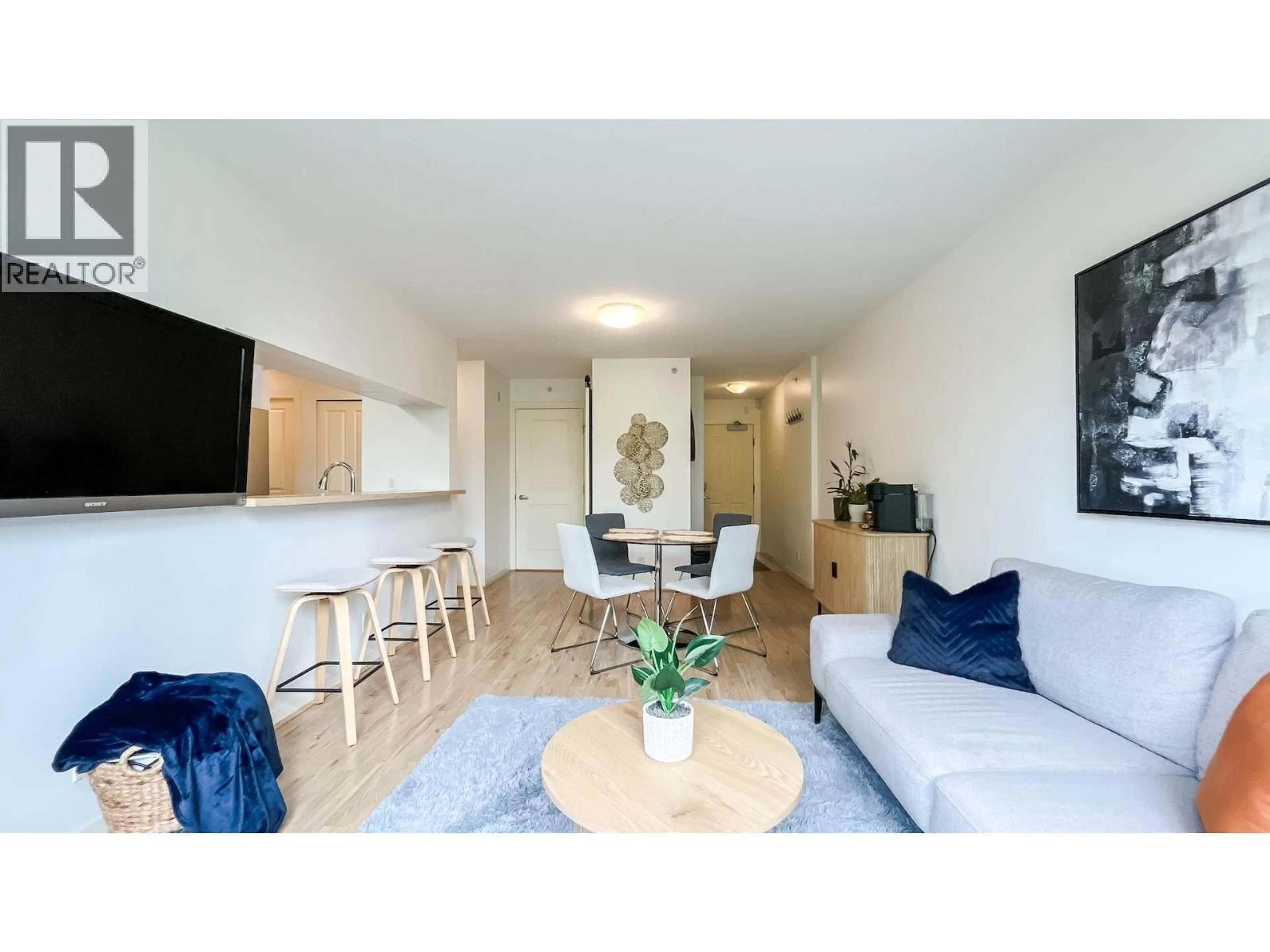 Living room with furniture, wood/laminate floor for 305 - 3638 VANNESS AVENUE, Vancouver British Columbia V5R6H6