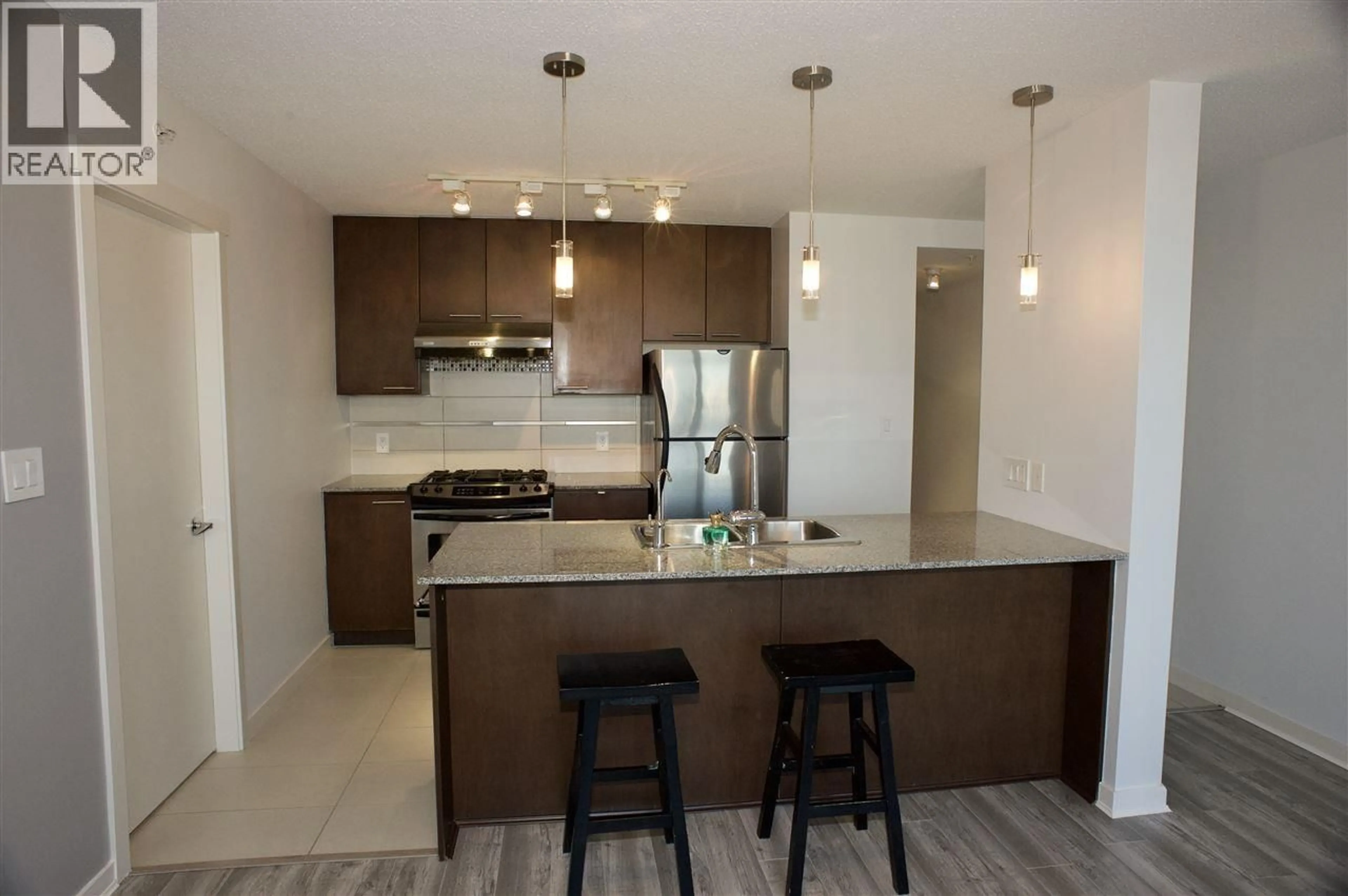 Open concept kitchen, unknown for 1102 - 5811 NO. 3 ROAD, Richmond British Columbia V6X4L7