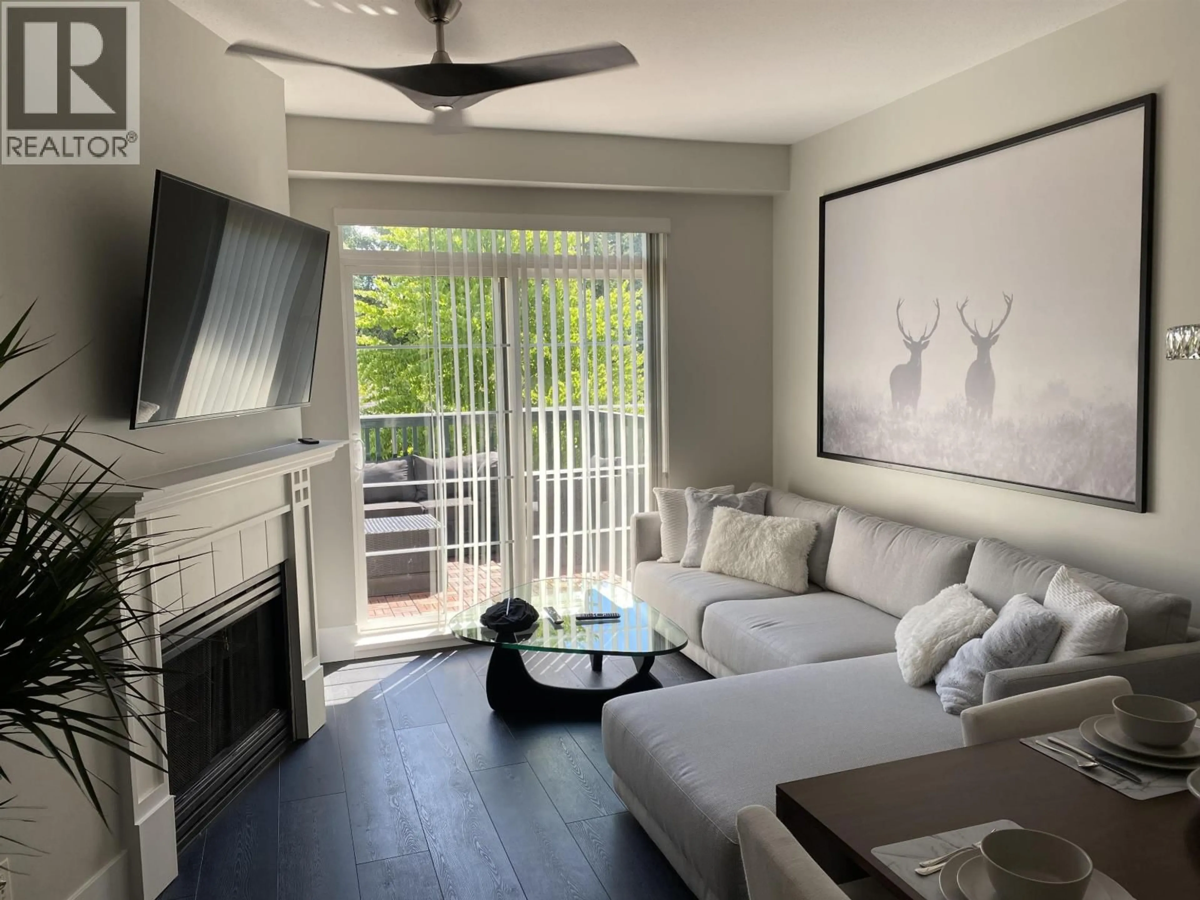 Living room with furniture, wood/laminate floor for 404 - 5605 HAMPTON PLACE, Vancouver British Columbia V6T2H2