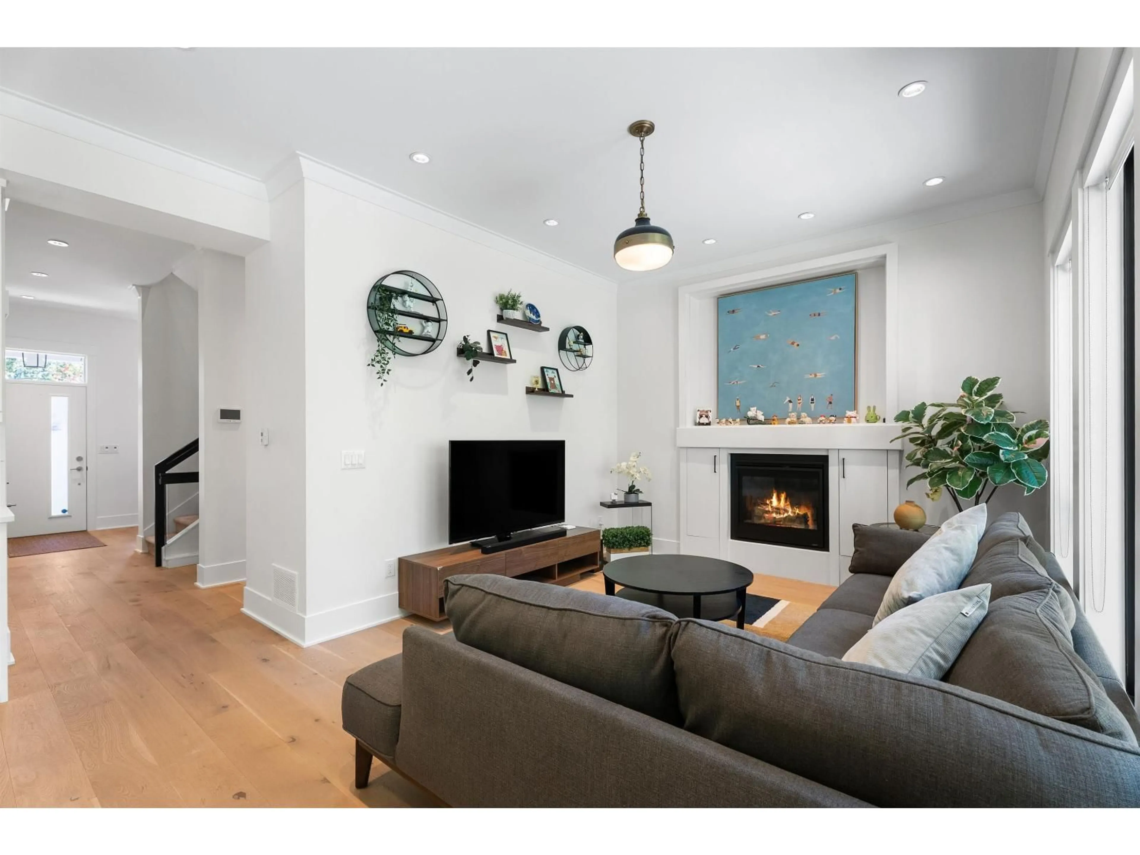 Living room with furniture, wood/laminate floor for 3323 147 STREET, Surrey British Columbia V4P1Z8