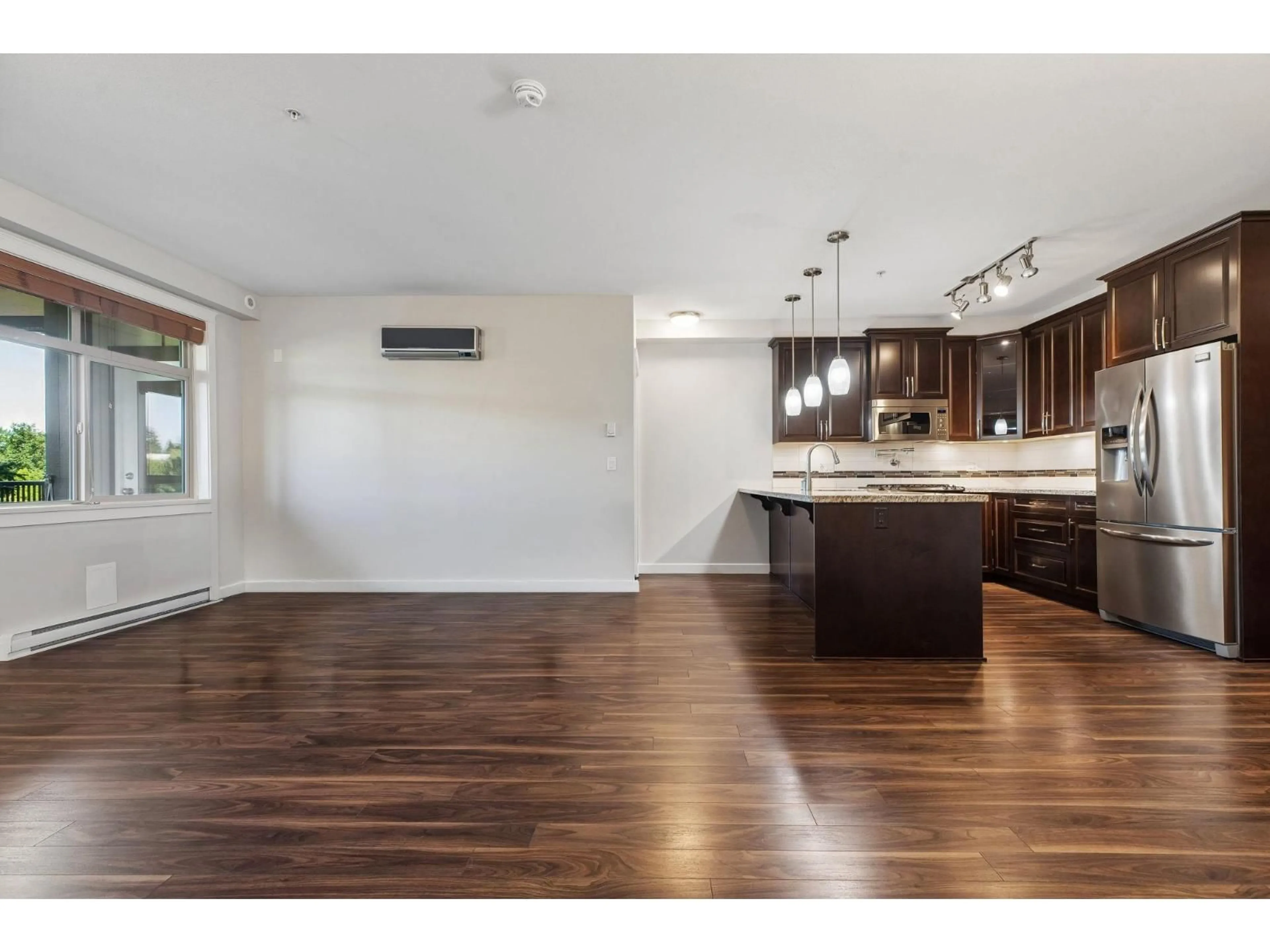 Open concept kitchen, wood/laminate floor for 228 - 8157 207 STREET, Surrey British Columbia V2Y0V3